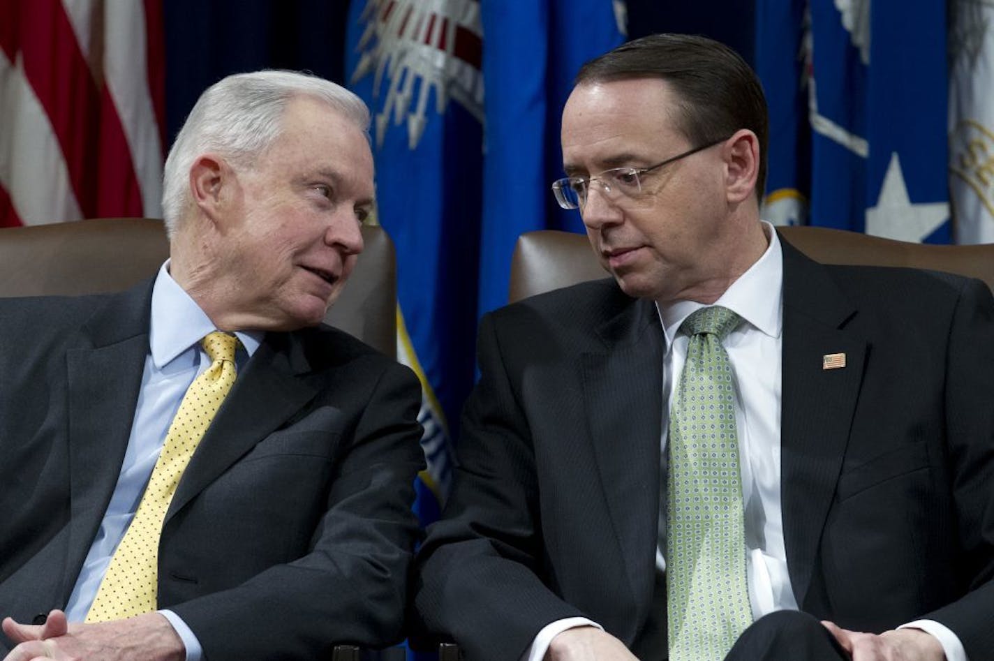 Attorney General Jeff Sessions speaks with Deputy Attorney General Rod Rosenstein during the opening ceremony of the summit on Efforts to Combat Human Trafficking at Department of Justice in Washington, Friday, Feb. 2, 2018. President Donald Trump, dogged by an unrelenting investigation into his campaign's ties to Russia, lashes out at the FBI and Justice Department as politically biased ahead of the expected release of a classified Republican memo criticizing FBI surveillance tactics.