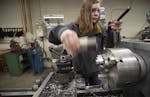 Catie Lonergan, a senior at St. Francis High School, on Monday made parts for MnDOT that will be used on street light fixtures.