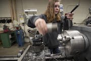 Catie Lonergan, a senior at St. Francis High School, on Monday made parts for MnDOT that will be used on street light fixtures.