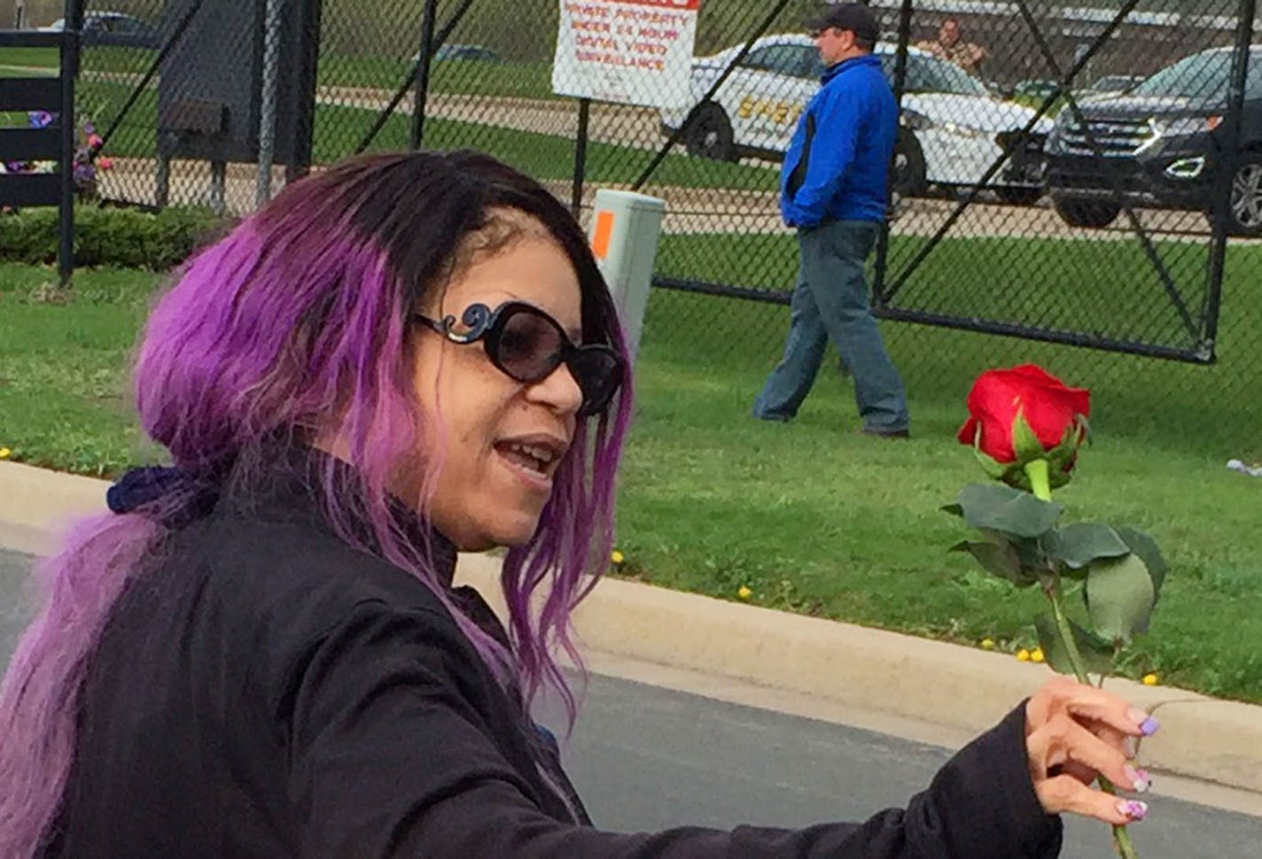 Tyka Nelson held a rose Thursday outside Paisley Park, the home of her brother Prince, in Chanhassen.