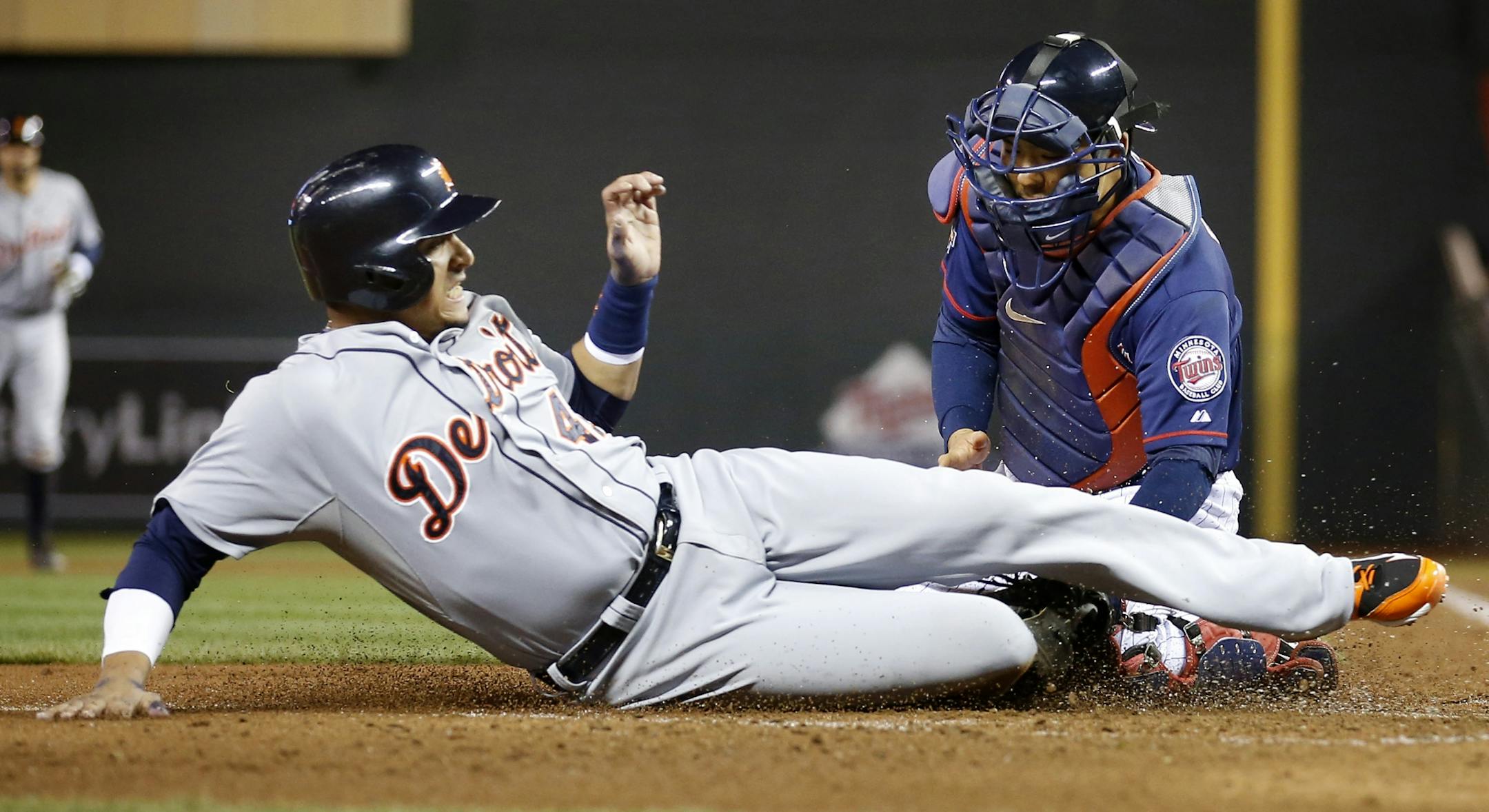 Minnesota Twins catcher Kurt Suzuki (8) tagged out Victor Martinez (41) at home plate in the fifth inning last fall. Martinez is expected to be ready for Opening Day 2015 after left knee surgery in February.
