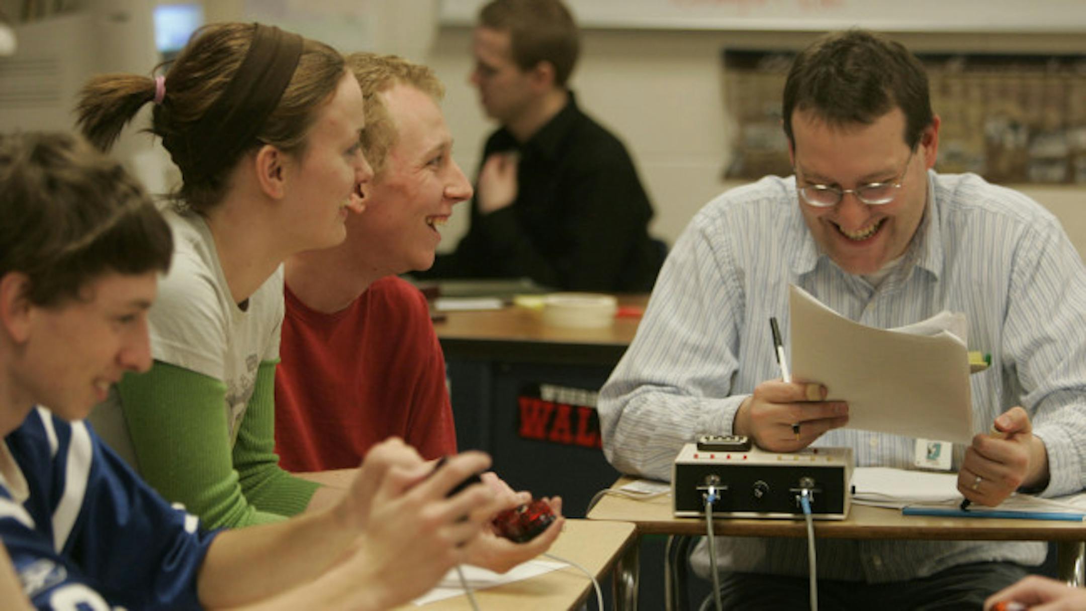 Armstrong Quiz Bowl members laughed it up with coach Matt Quinn during practice. The school sent two teams to nationals this year.