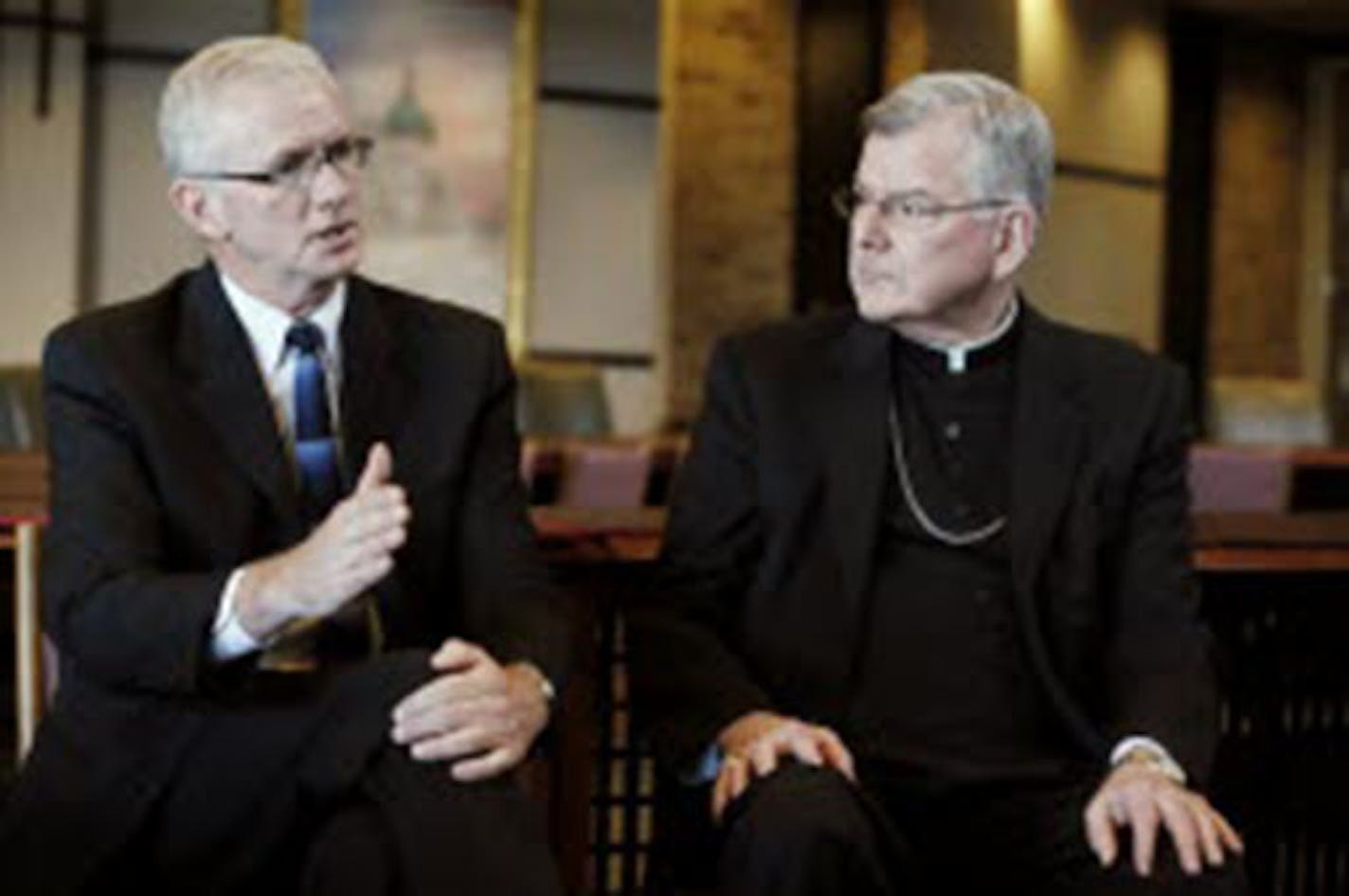 Judge Timothy O'Malley, left, and Archbishop John Nienstedt talked about the appointment of O'Malley to the new position of director of Ministerial Standards and Safe Environment for the Archdiocese of St. Paul and Minneapolis on Monday August 25, 2014, in St. Paul.