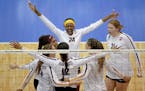 Minnesota outside hitter Adanna Rollins (20) celebrated a block by middle blocker Taylor Morgan (12) during a match against Louisville in the fourth r