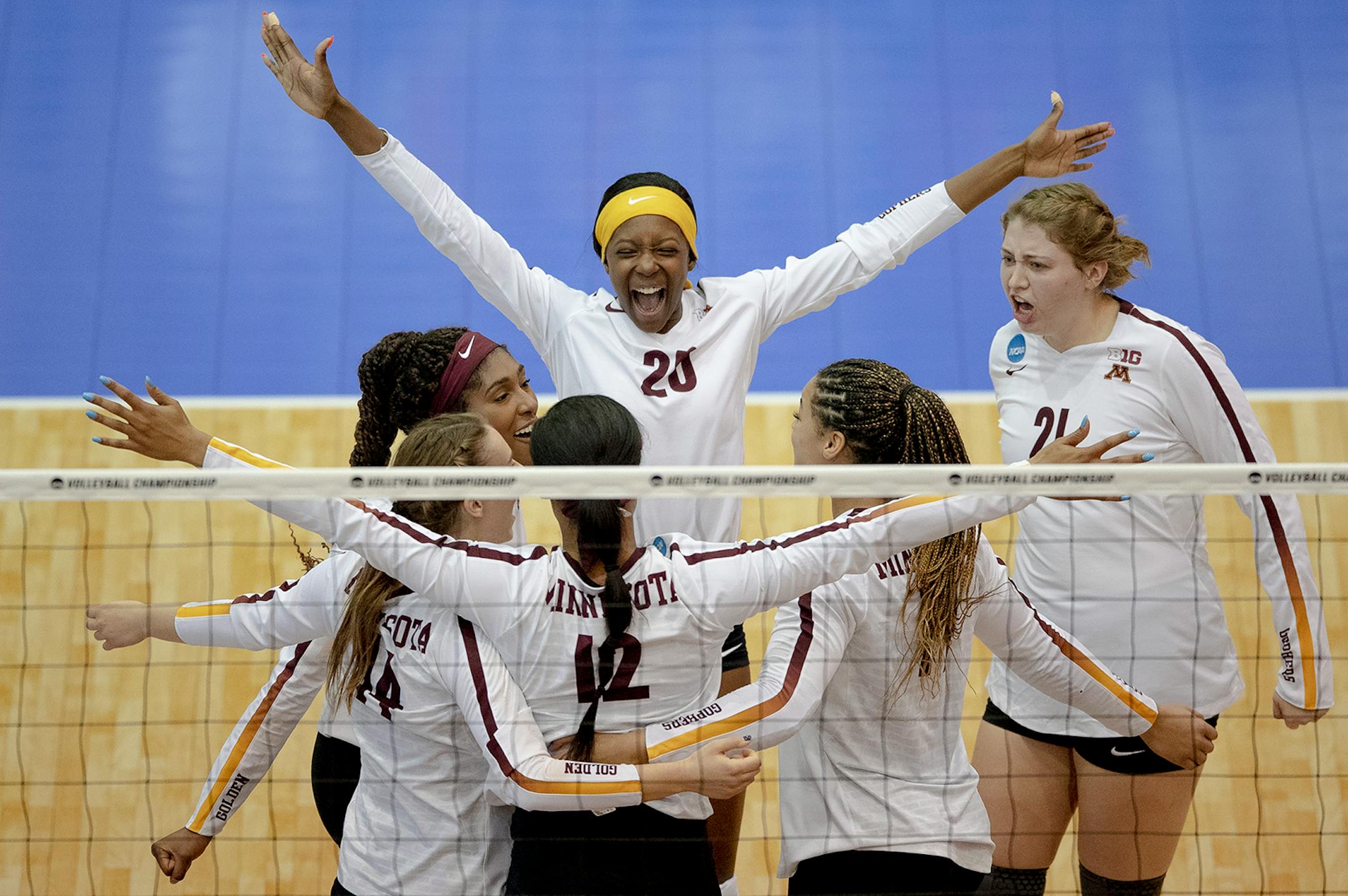 Minnesota outside hitter Adanna Rollins (20) celebrated a block by middle blocker Taylor Morgan (12) during a match against Louisville in the fourth round of the NCAA volleyball tournament on Saturday, Dec. 14, 2019, in Austin, Texas. (Nick Wagner/Special to the Star Tribune) ORG XMIT: MIN1912141940147777