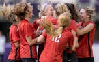 Allyson Hamski (6), middle, of Centennial celebrates with teammates after a scoring a goal late in the second half in the Class 3A girl's soccer state