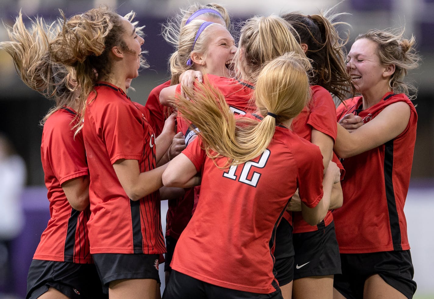 Allyson Hamski (6), middle, of Centennial celebrates with teammates after a scoring a goal late in the second half in the Class 3A girl's soccer state tournament semifinals at U.S. Bank Stadium Thursday, Nov. 4, 2021 in Minneapolis, Minn. ] CARLOS GONZALEZ • cgonzalez@startribune.com