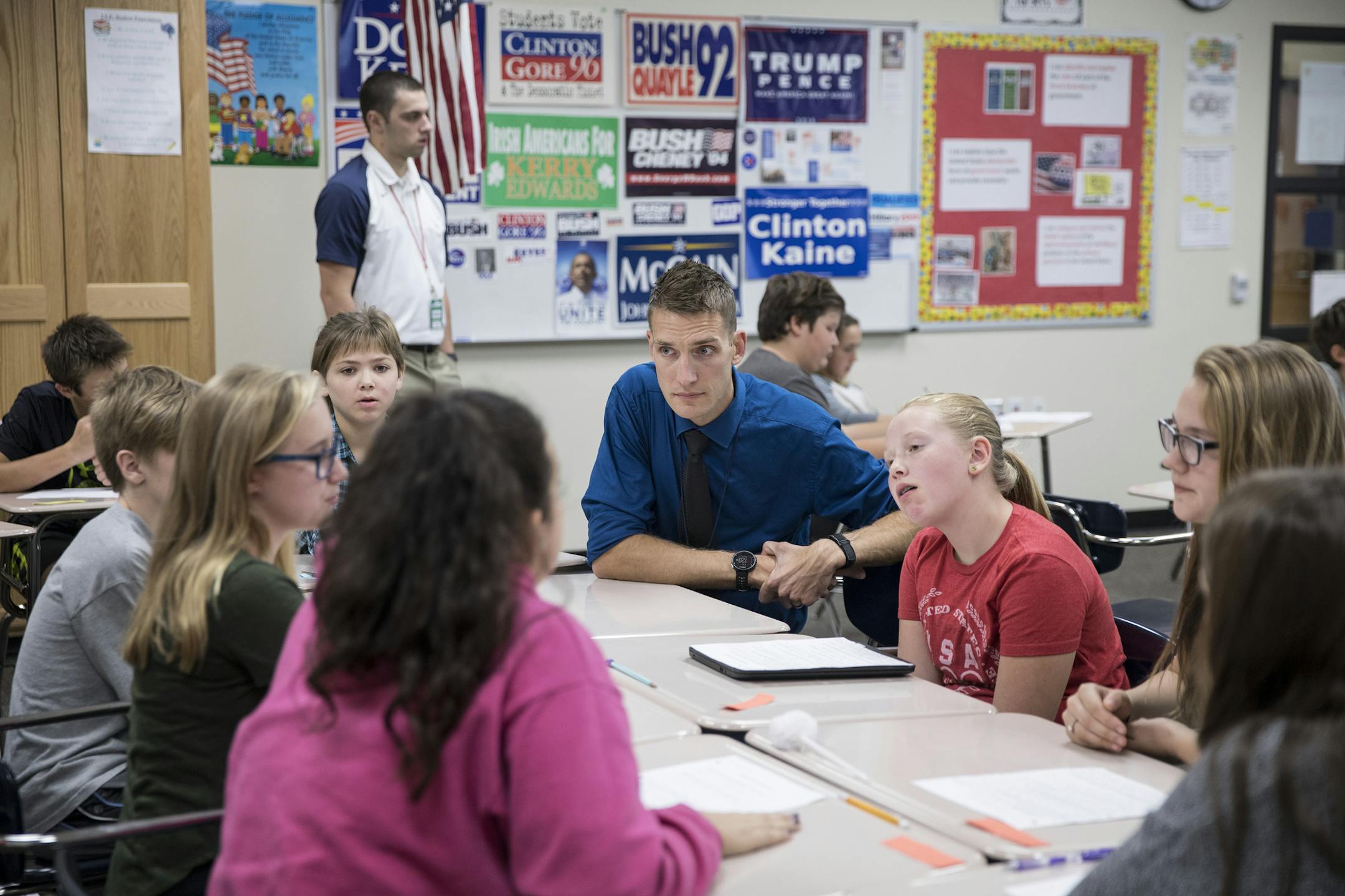 Brent Wathke, a social studies teacher, watches his students as they discuss the election at DeLong Middle School in Eau Claire, Wis., Oct. 13, 2016. Wathke is one of countless teachers across the country who have anguished over the shocking tone of the presidential campaign and questioned whether or not it is appropriate to show to his class. (Jenn Ackerman/The New York Times)