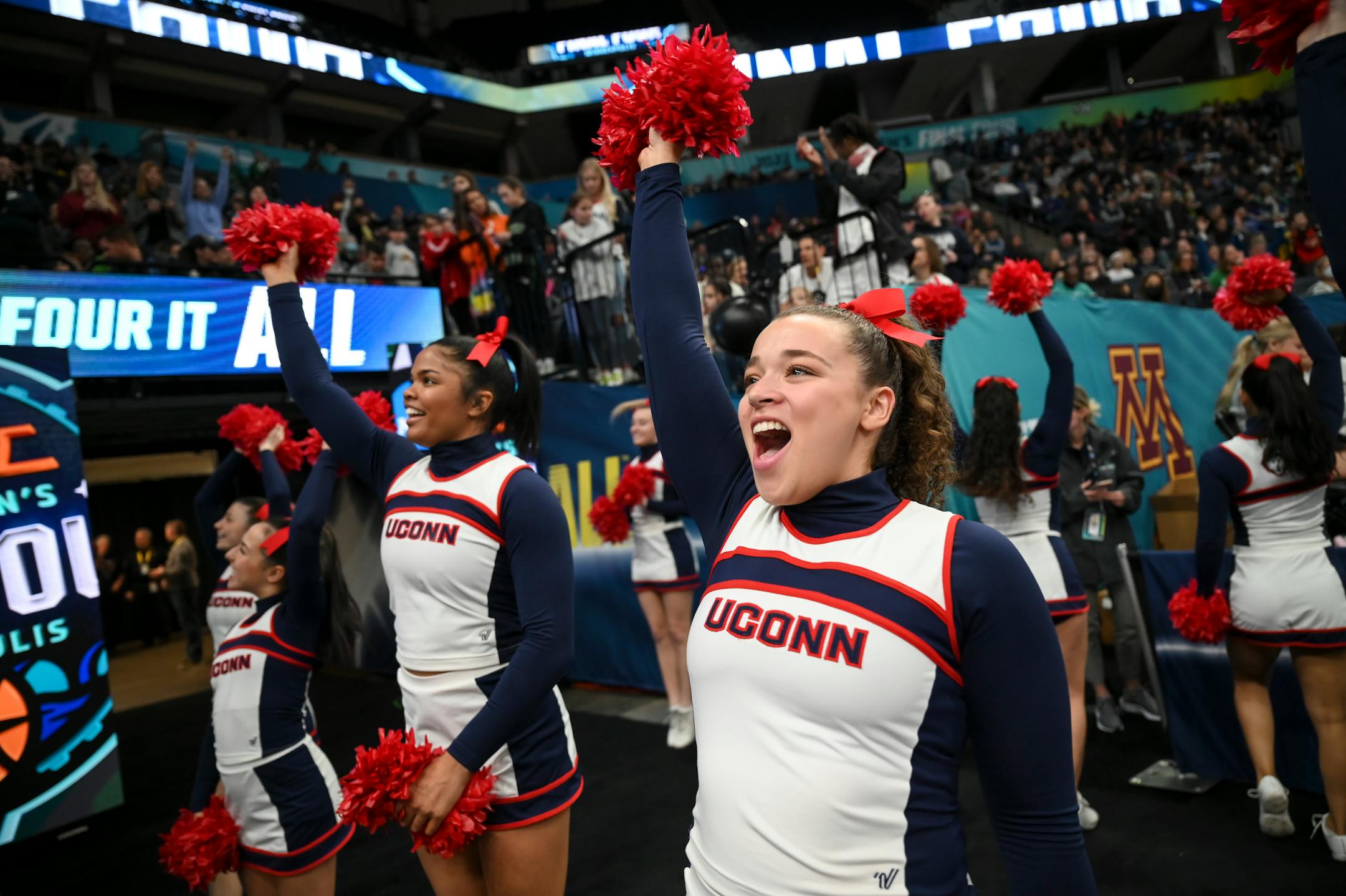 UConn cheerleaders hype up the crowd before the team's arrival during a Final Four open practice held Saturday, April 2, 2022 at Target Center in Minneapolis, Minn.
