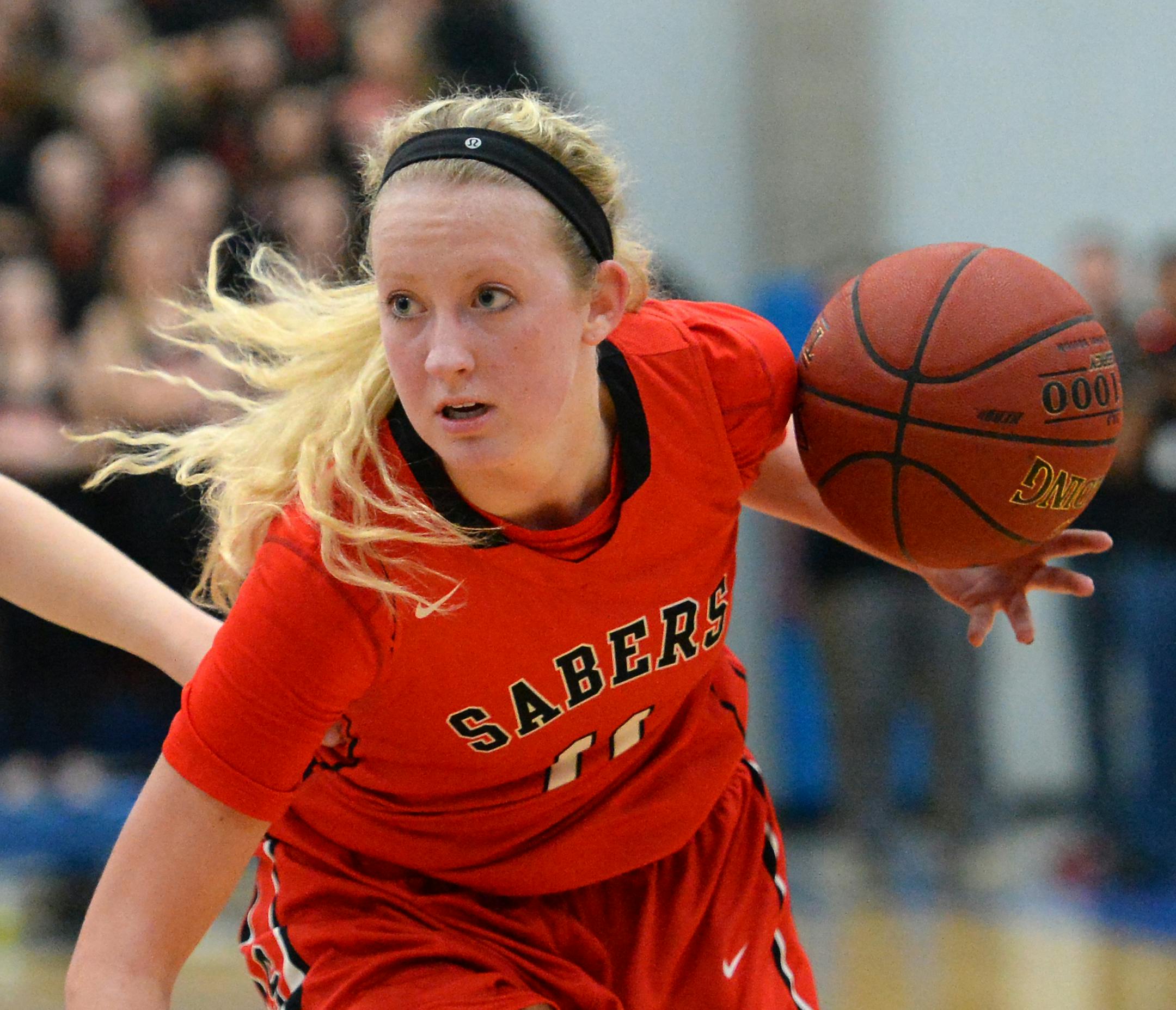 In this photo taken March 11, 2016, Shakopee guard Taylor Koenen (11) dribbles the ball against Minnetonka during the the Class 4A, Section 2 girls' basketball final at Hopkins High School in Minnetonka, Minn. Koenen was selected as the Minnesota Associated Press Player of the Year for girls basketball on Tuesday, March 22, 2016. (Aaron Lavinsky/Star Tribune via AP)