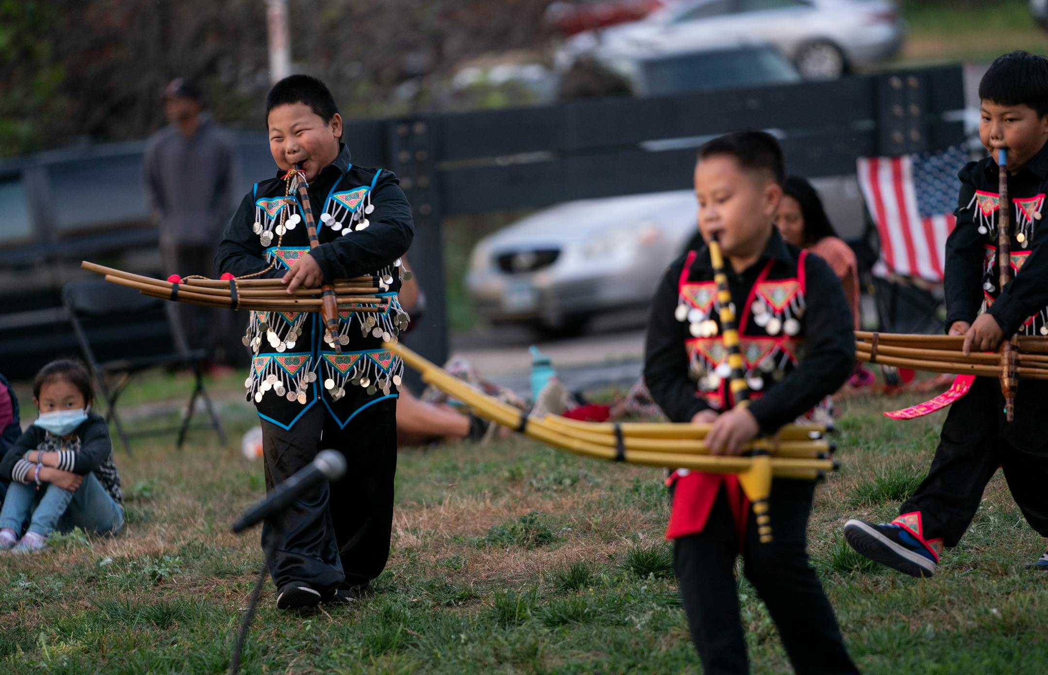 At left, Jo Jo Yang smiled as he and other boys in the group Niam Nkauj Mog Min performed traditional Hmong shaman during Indigenous Peoples Day ceremony held to dedicate and honor the land that will house the new Wakan Tipi Center in St. Paul, Minn., on Monday, October 11, 2021.