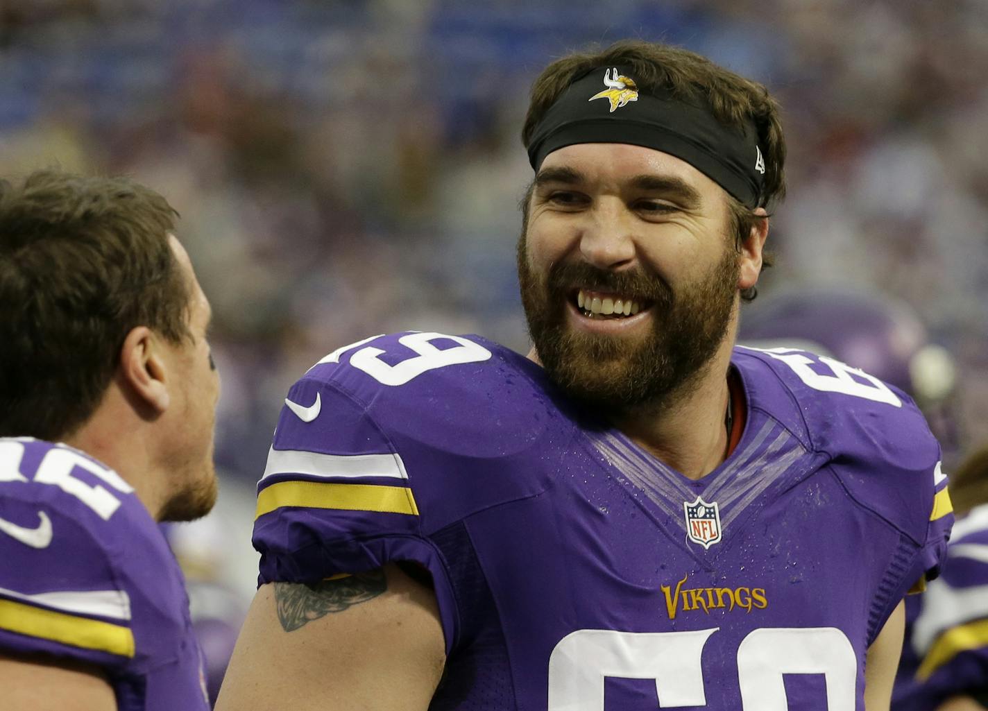 FILE - In this Dec. 29, 2013 file photo, Minnesota Vikings outside linebacker Chad Greenway, left, laughs with teammate Jared Allen before an NFL football game against the Detroit Lions, in Minneapolis. The Minnesota Vikings have signed defensive end Jared Allen to a ceremonial one-day contract to allow the four-time All-Pro to formally retire as a member of the team. The Vikings made the announcement Thursday, April 14, 2016. (AP Photo/Ann Heisenfelt, File)