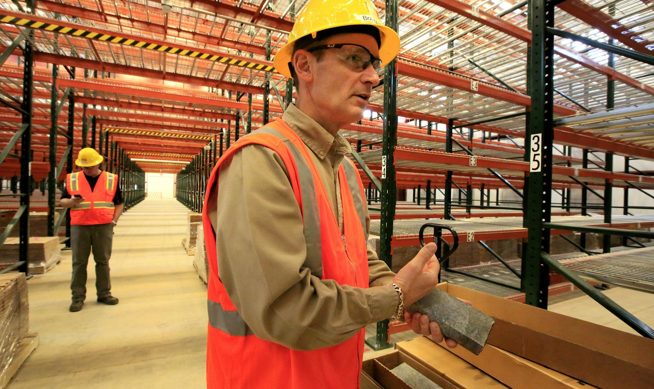 Not since the battle of 1978 to designate the BWCA as a wilderness area has the town of Ely been so divided. This time it's the possibility of Copper/Nickel mining and the promised jobs it brings -vs- the fear that mining so close to the BWCA could contaminate the water. Here, Bob McFarlin, Twin Metals Vice President of Public & Government Affairs, shows a core sample in the new core storage facility in Ely. ]
BRIAN PETERSON ¥ brianp@startribune.com
ELY, MN - 05/30/2013