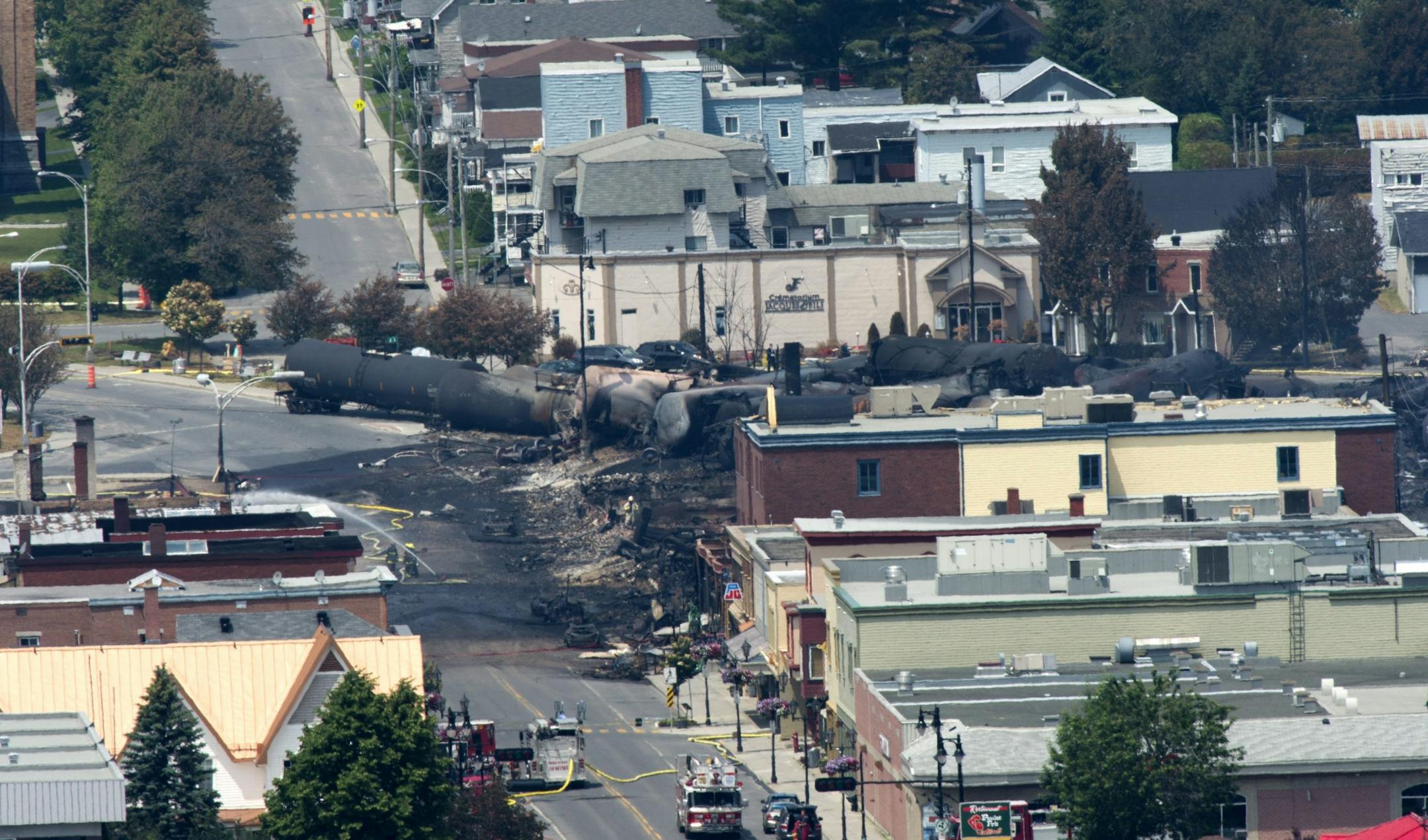 Damage in the downtown of Lac Megantic, Quebec is seen Sunday, July 7, 2013, the day after a train derailed causing explosions of railway cars carrying crude oil.