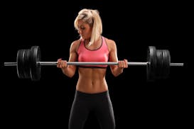 The key to strength training is progressive overload, which entails increasing either the weights you're lifting or the difficulty of the exercises yo