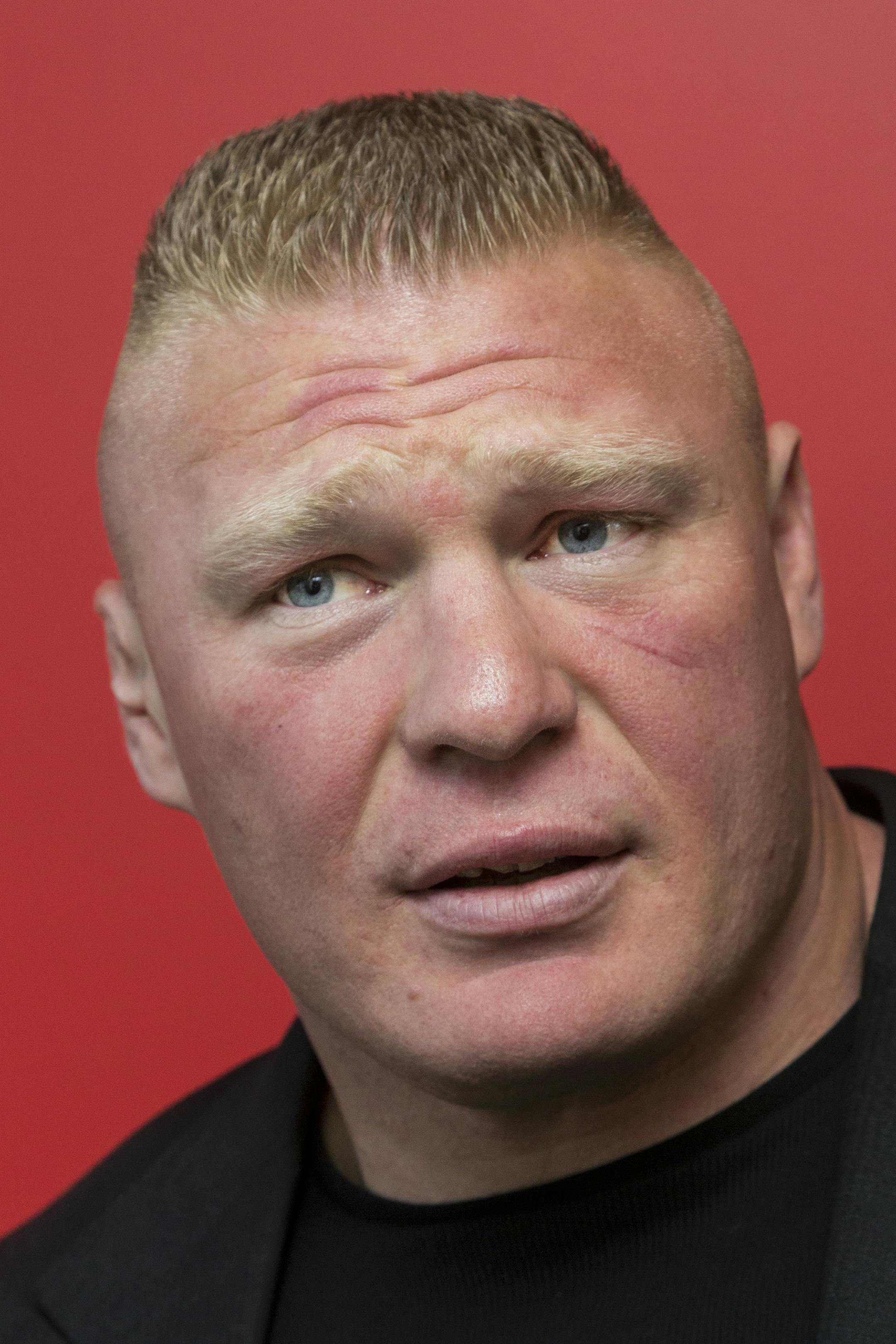 Former UFC heavyweight champion Brock Lesnar pauses for a photo after ruling out a return to mixed martial arts, ending three years of speculation about the biggest pay-per-view star in the sport's history, as he announced he had re-signed with WWE in an interview on ESPN's "SportsCenter," in Los Angeles on Tuesday, March 24, 2015. Lesnar tells The Associated Press he was in training for a UFC return as recently as last week despite his conflicted feelings about it. He finally decided to stick w