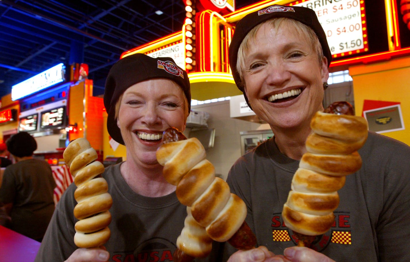 St. Paul, MN 8/26/2002 The Sisters Sausage Co. Merry Barry and Cherie Peterson at the Minnesota State Fair Food building.