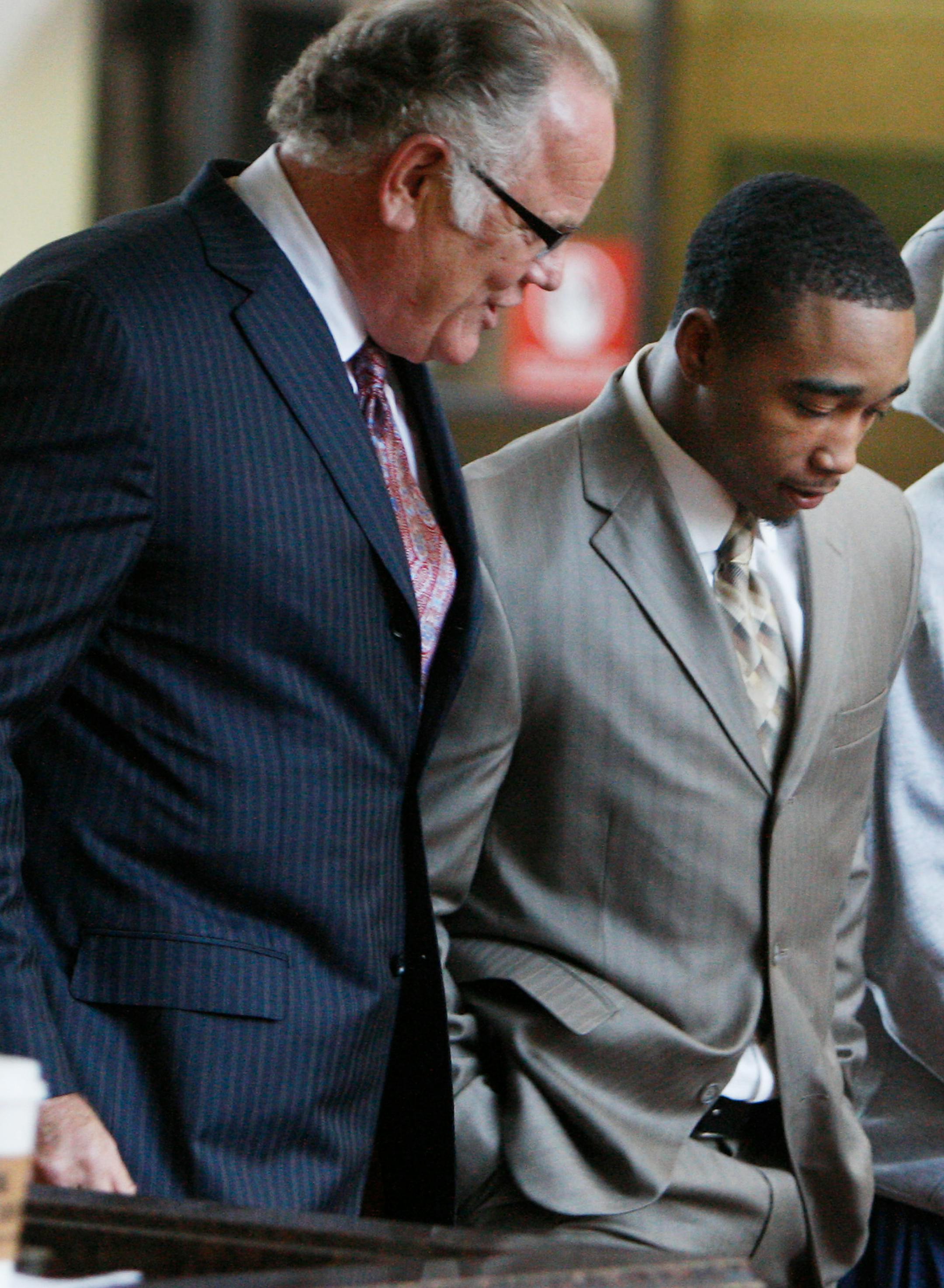 Attorney Earl Gray and former Gophers football player Dominic Jones.