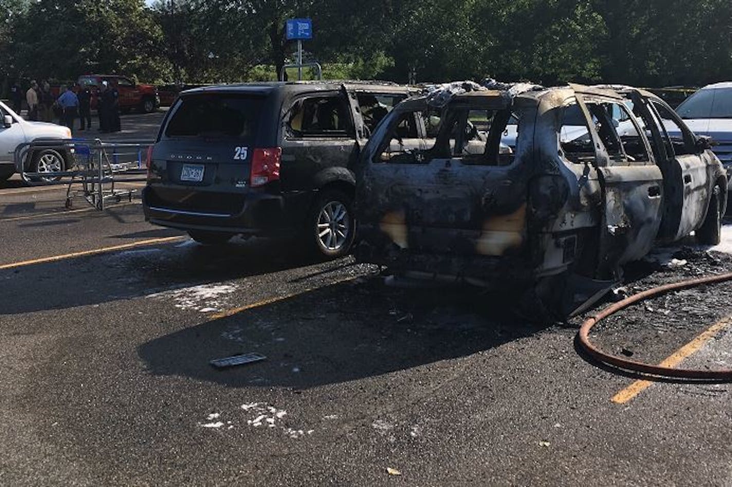 These two vans caught fire outside a Walmart in Fridley.