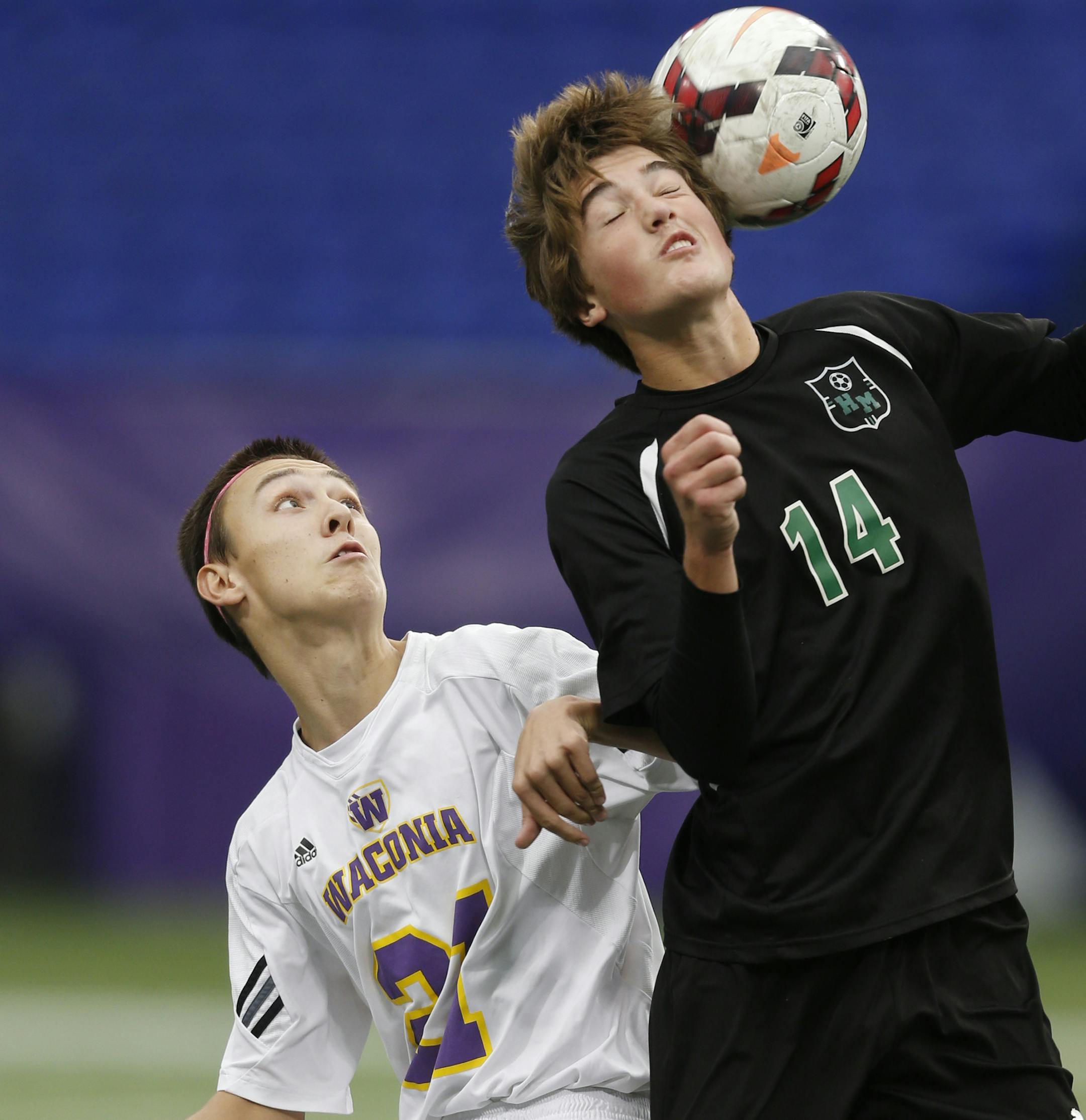 At the Metrodome in a match between 1A boys Hill-Murray and Waconia, Waconia's Anthon Shuster(21) watches as Henry Ventura(14) goes for a header. ]richard tsong-taatarii/rtsong-taataarii@startribune.com