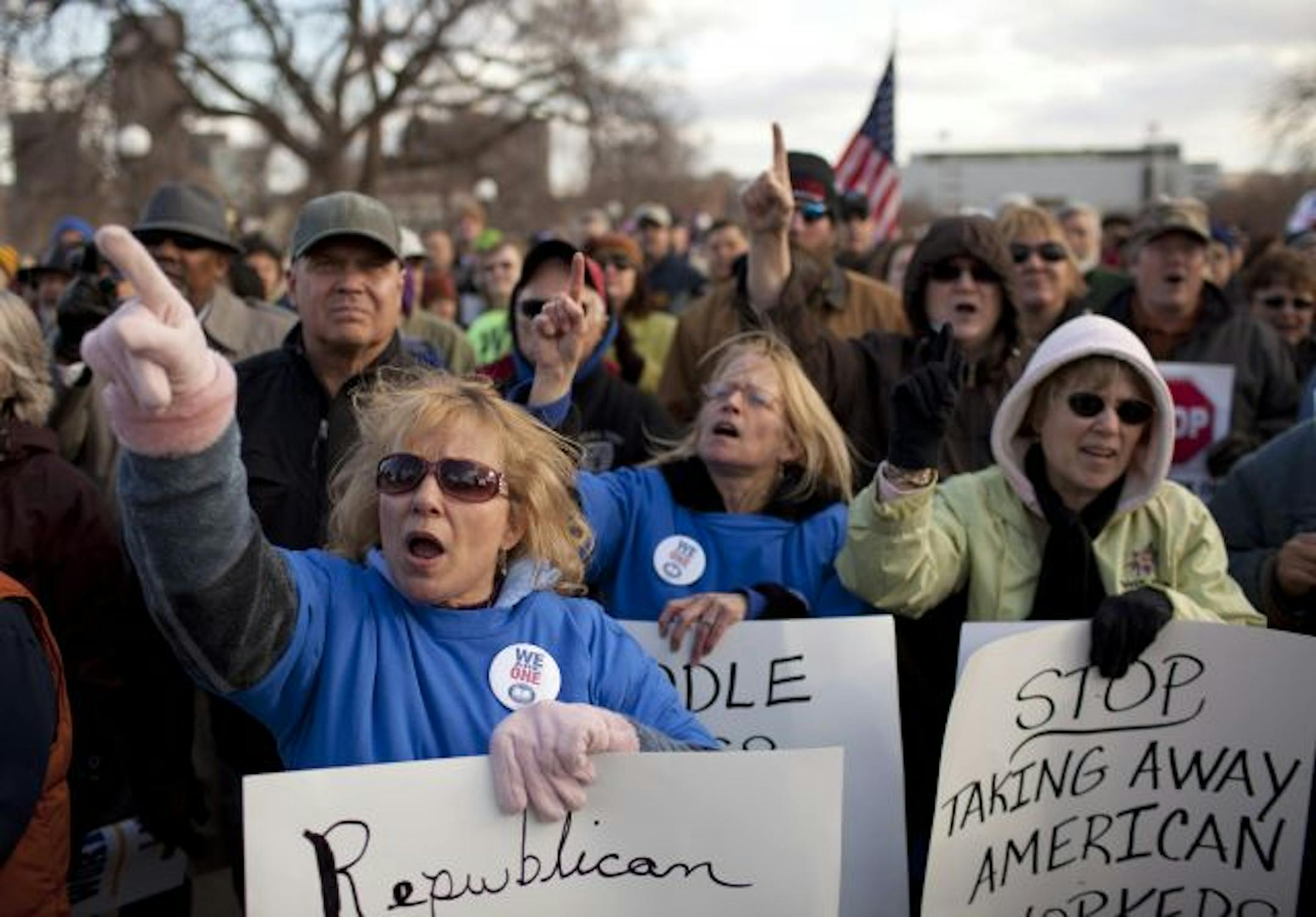 Sisters Mary Bailey, Lou Ann Vogt, and Cindy Vangsness, from left, chanted "We are one" along with the crowd after former Minneapolis NAACP president Matthew Little addressed union supporters at the rally after The March for the Middle Class Monday afternoon.