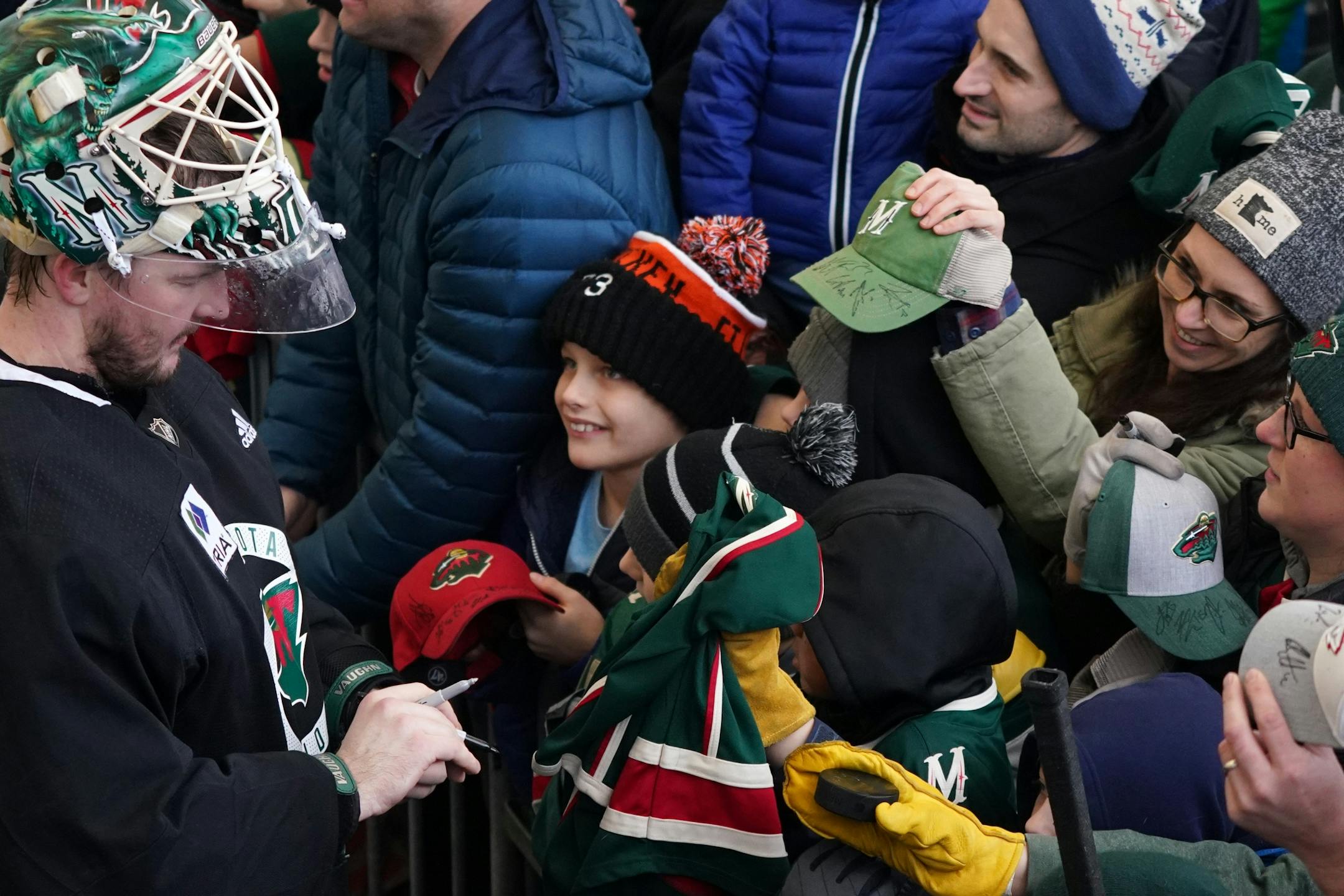 Minnesota Wild goaltender Devan Dubnyk (40) signed autographs following the Wild's outdoor practice Thursday.
