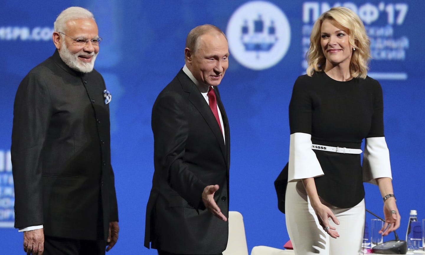 Russian President Vladimir Putin, second right, Austrian Chancellor Christian Kern, left, Moldovan President Igor Dodon, second left, India's Prime Minister Narendra Modi, center, and NBC journalist Megyn Kelly, right, attend the St. Petersburg International Economic Forum in St. Petersburg, Russia, Friday, June 2, 2017. (Vladimir Smirnov/TASS News Agency Pool Photo via AP)