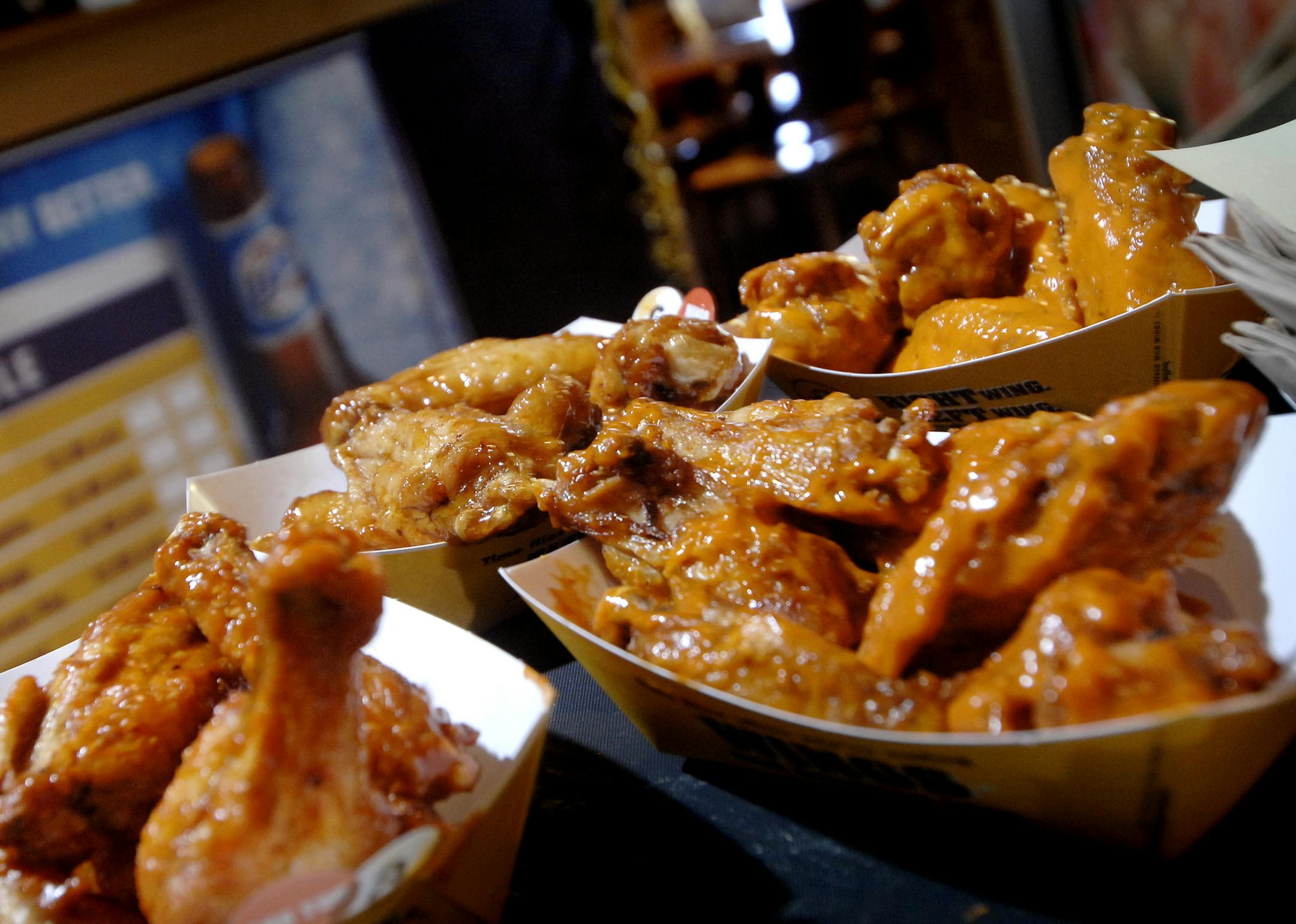 A platter of Buffalo Wild Wings is served to lunch-hour customers at the Buffalo Wild Wings restaurant in Oakdale, Minn.
