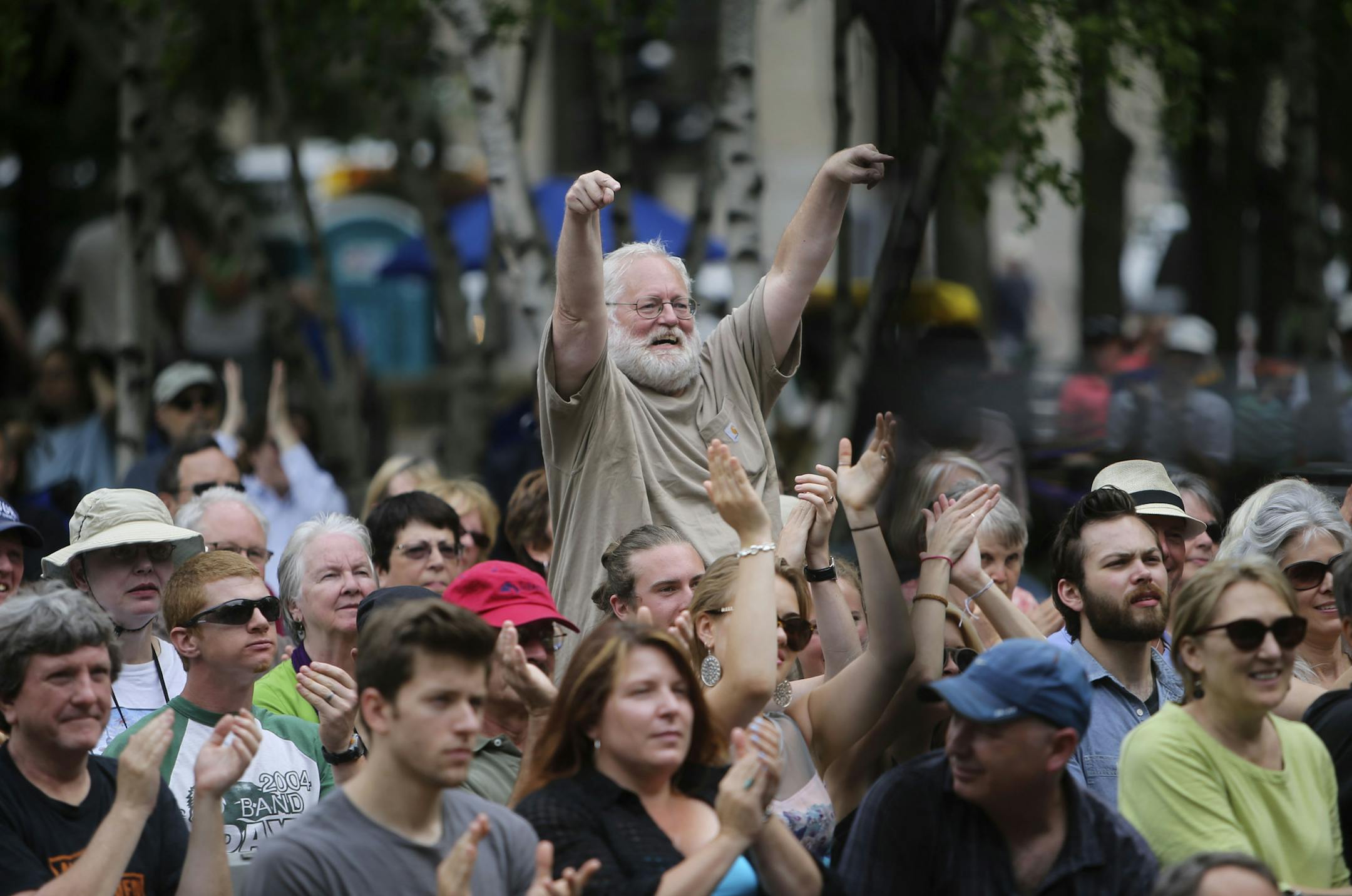 Jazz fan Mark Trucker of Minneapolis showed some love for Red Planet as their wrapped up their set at the St. Paul Jazz Fest Friday, June 27, 2014, in Mears Park in St. Paul, MN.] (DAVID JOLES/STARTRIBUNE) djoles@startribune St. Paul Jazz Fest Friday, June 27, 2014at Mears Park in St. Paul, MN.