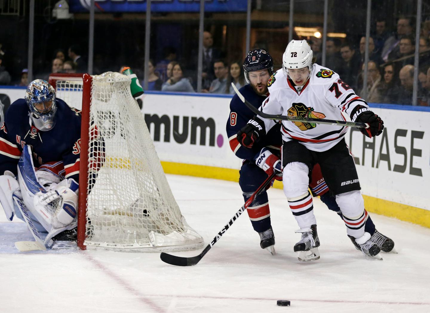 Chicago Blackhawks left wing Artemi Panarin (72) competes for control of the puck with New York Rangers defenseman Kevin Klein (8) during the third period of an NHL hockey game Wednesday, Feb. 17, 2016, in New York. The Blackhawks defeated the Rangers 5-3. (AP Photo/Adam Hunger)