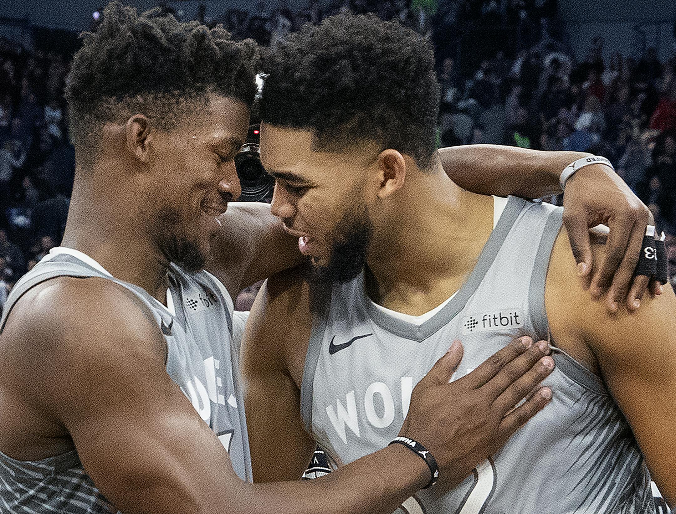 Minnesota Timberwolves Karl-Anthony Towns and Jimmy Butler (23) celebrated at the end of the game. ] CARLOS GONZALEZ ï cgonzalez@startribune.com ñ April 11, 2018, Minneapolis, MN, Target Center, NBA, Basketball, Minnesota Timberwolves vs. Denver Nuggets