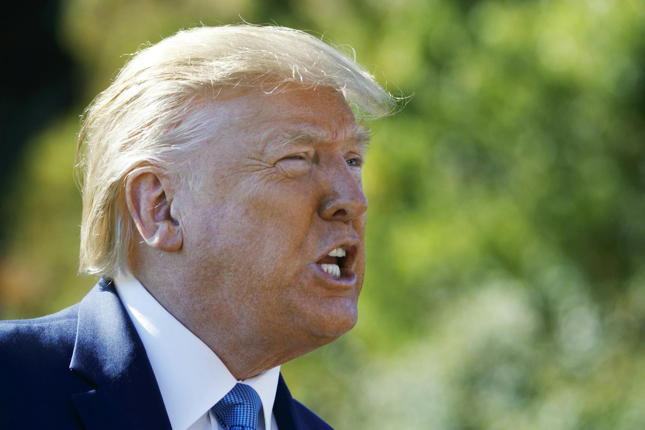 President Donald Trump speaks to members of the media as he leaves the White House, Wednesday, Oct. 23, 2019, in Washington, en route to Pittsburgh. (AP Photo/Jacquelyn Martin)