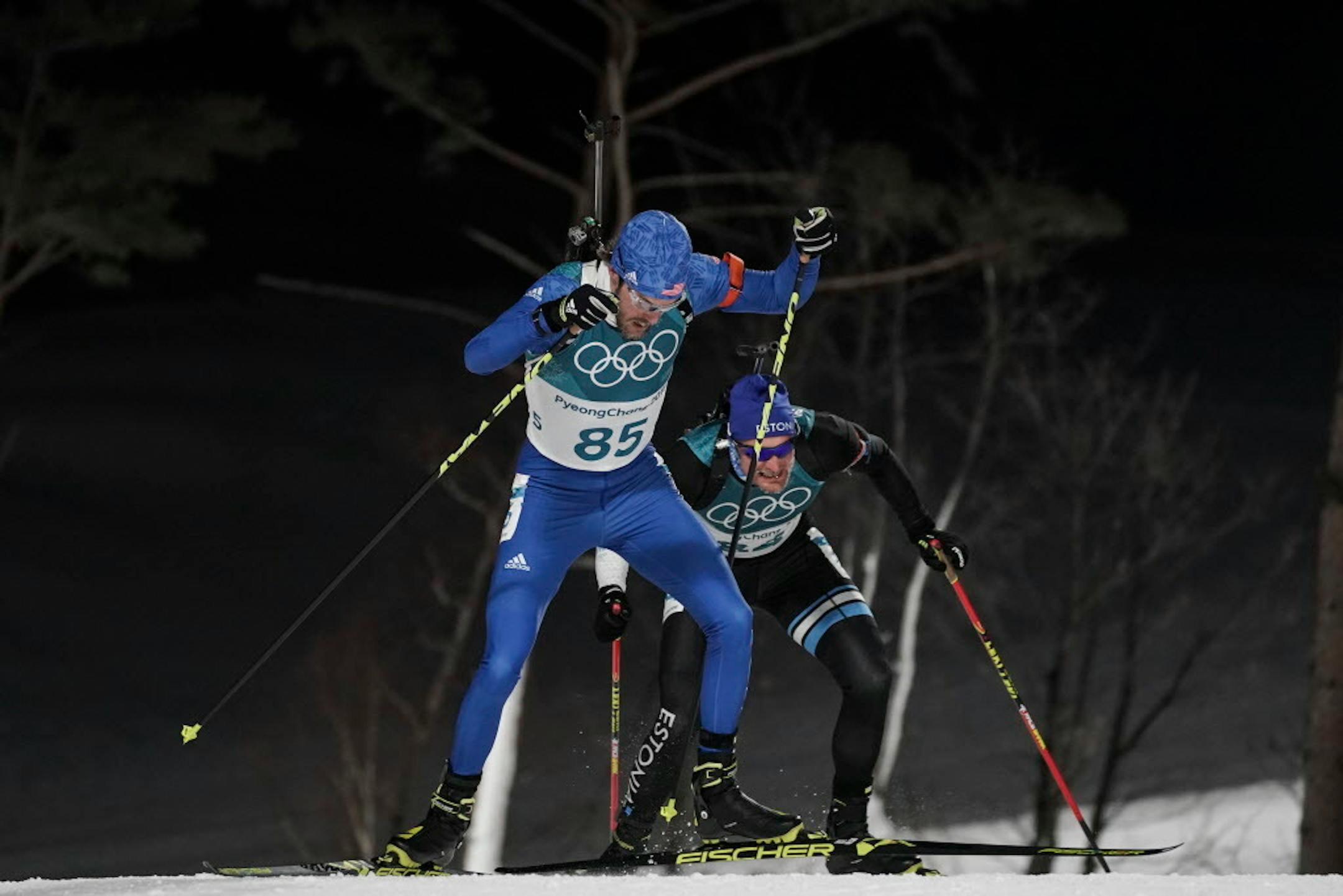 Leif Nordgren, of the United States, climbs ahead Kauri Koiv, of Estonia, during the men's 10-kilometer biathlon sprint at the 2018 Winter Olympics in Pyeongchang, South Korea, Sunday, Feb. 11, 2018. (AP Photo/Felipe Dana)
