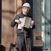 In this Wednesday, April 15, 2020 photo, musician Paul Stein, who has played the accordion since he was eight, entertains neighbors with an "Emergency