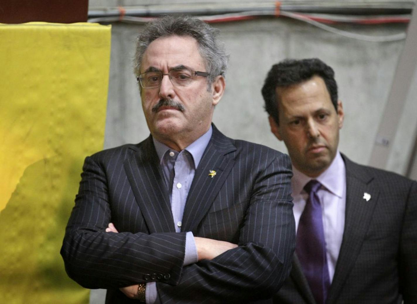 Vikings owner Zygi Wilf and his brother, President of the Vikings, Mark Wilf, listen to Rick Spielman, named new General Manager of the franchise. Spielman joined the team in 2006 and has served as Vice President of Player Personnel during his tenure with the Vikings.