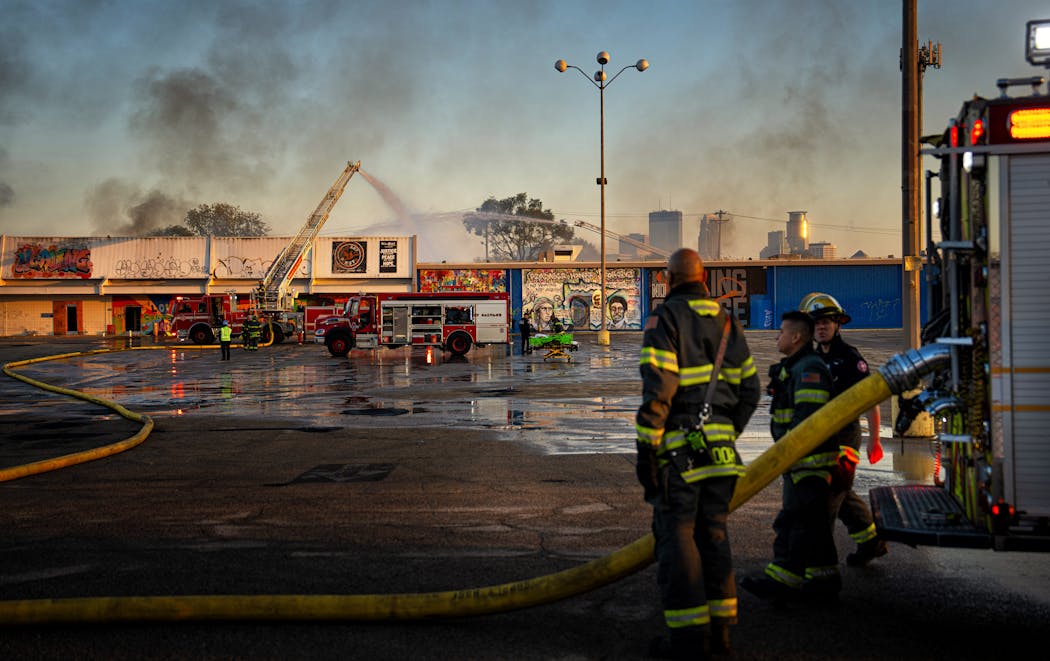 Minneapolis firefighters worked to contain a fire Friday morning at the former Kmart store at Lake Street and Nicollet Avenue in Minneapolis.