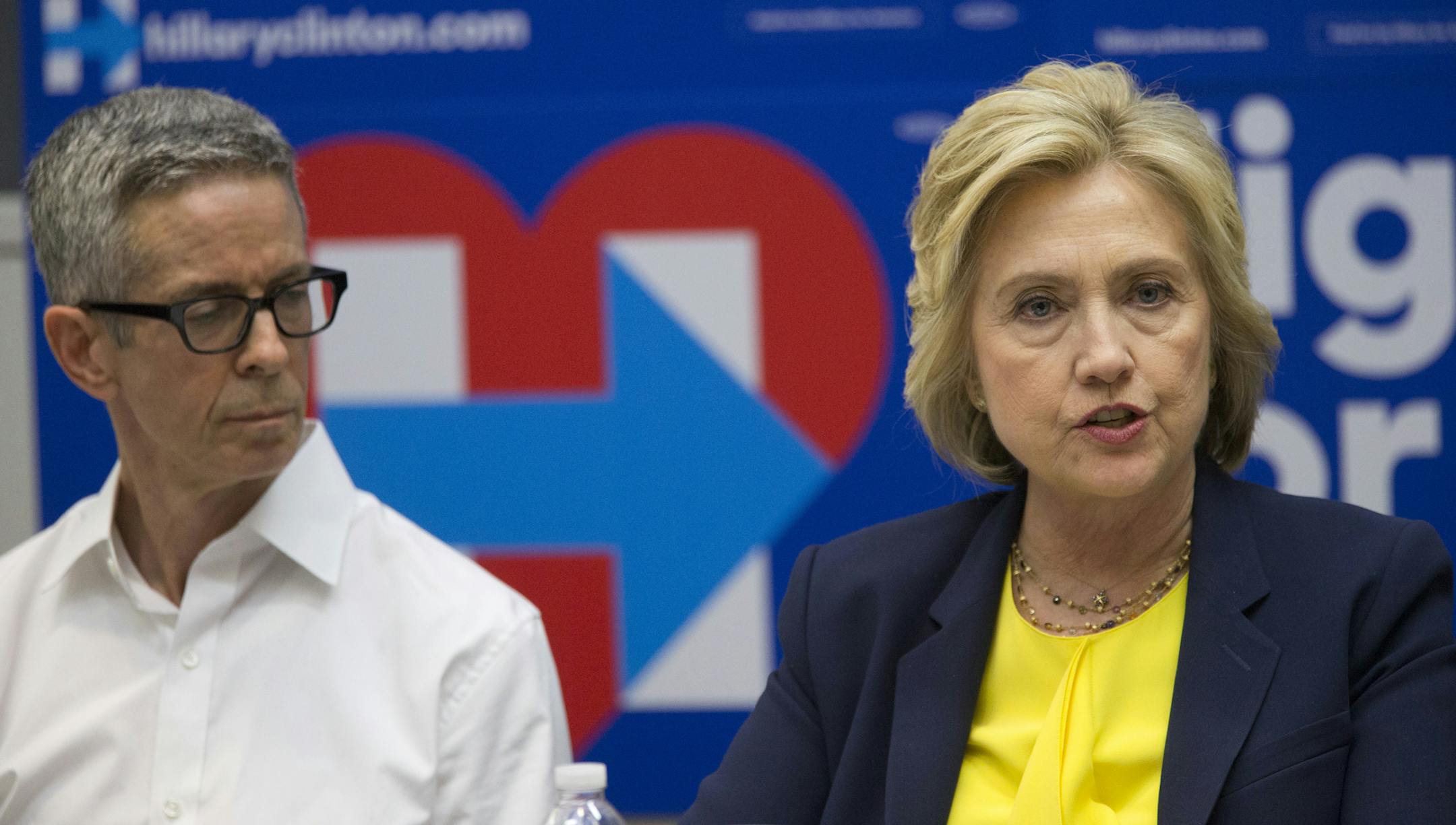 Democratic presidential candidate Hillary Clinton, right, is joined by AIDS activist Peter Staley as she participates in a round table discussion with HIV/AIDS activists, Thursday, May 12, 2016, in New York. (AP Photo/Mary Altaffer)