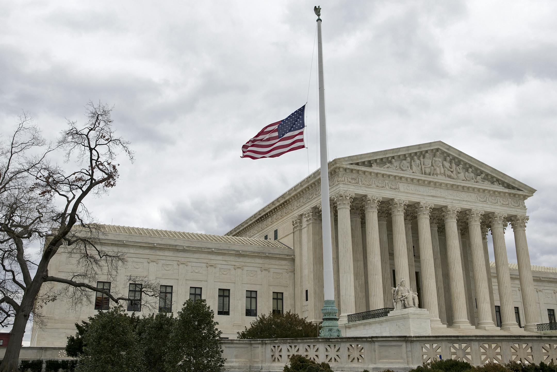 In honor of Justice Antonin Scalia who died on Feb. 13, 2016, the flags in the Supreme Court building's front plaza will continue to fly at half-staff for a month, in Washington, Thursday, Feb. 25, 2016. Scaliaís unexpected death triggered an election-year political standoff on Capitol Hill as leaders in the GOP-controlled Congress insist President Obama should not nominate a replacement for Scalia and should leave that for the next president who is elected in November. (AP Photo/J. Scott A
