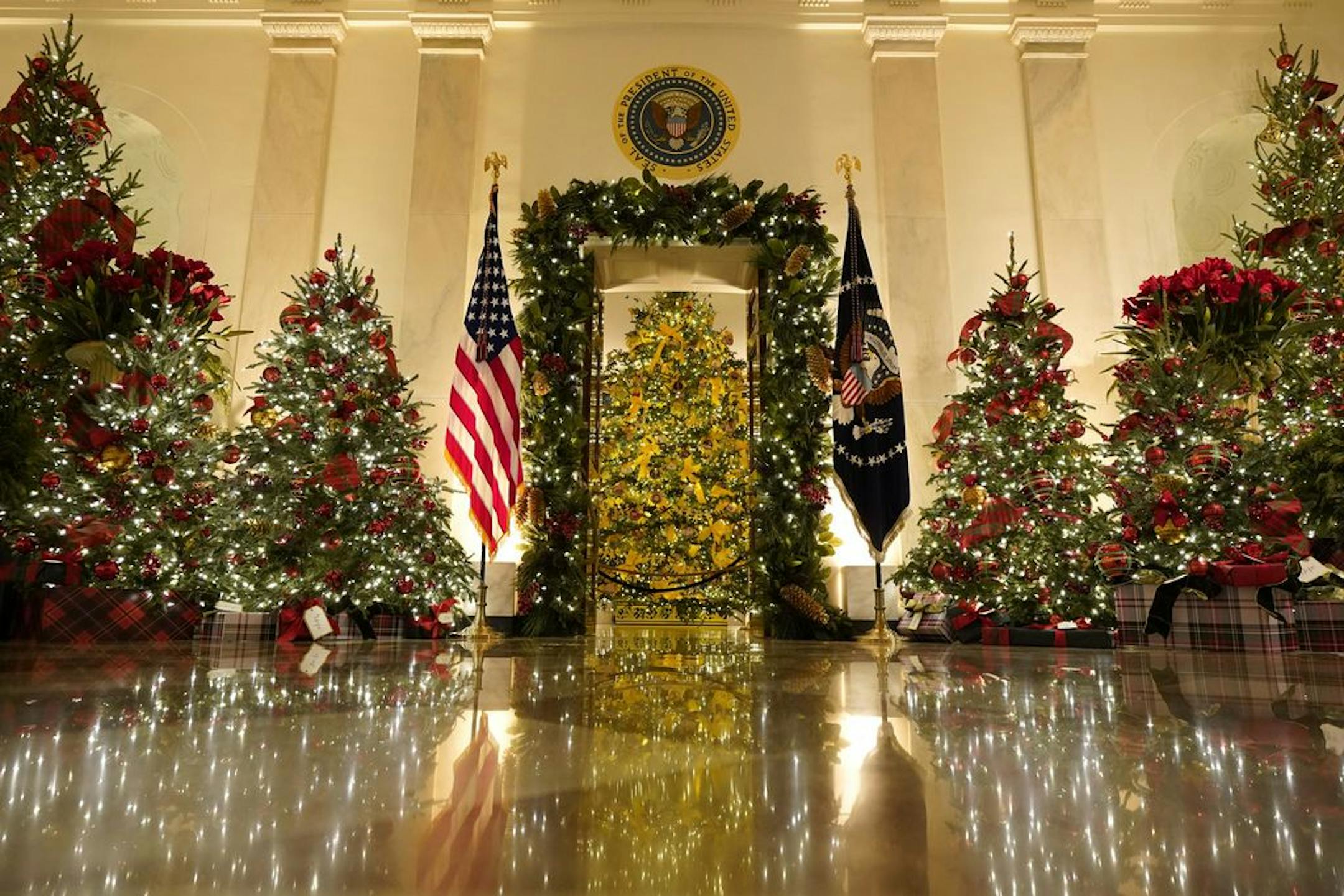 Cross Hall and the Blue Room are decorated during the 2020 Christmas preview at the White House, Monday, Nov. 30, 2020, in Washington.