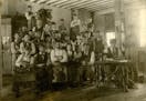 Students in a shoemaking class in Faribault posed for a photo in the 1890s. This photograph was likely taken at the school for the deaf.