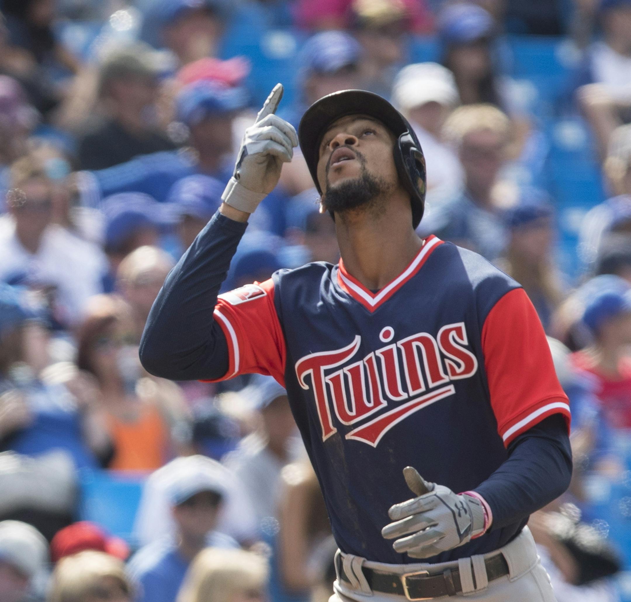 Minnesota Twins Byron Buxton gestures as he approaches home plate after hitting a solo home run off Toronto Blue Jays relief pitcher Tim Mayza during the ninth inning of baseball game action in Toronto, Sunday, Aug. 27, 2017. (Chris Young/The Canadian Press via AP)