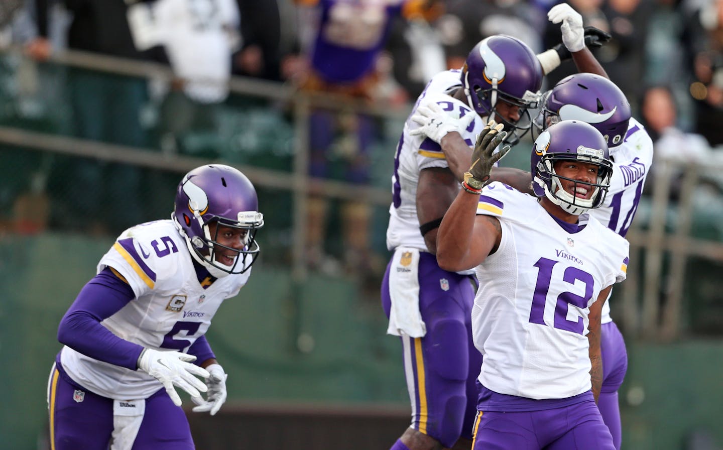 Adrian Peterson celebrated with wide receiver Stefon Diggs (14) in the background as Teddy Bridgewater (5) and Charles Johnson (12) celebrated Peterson's 80 yard touchdown run late in the forth quarter.