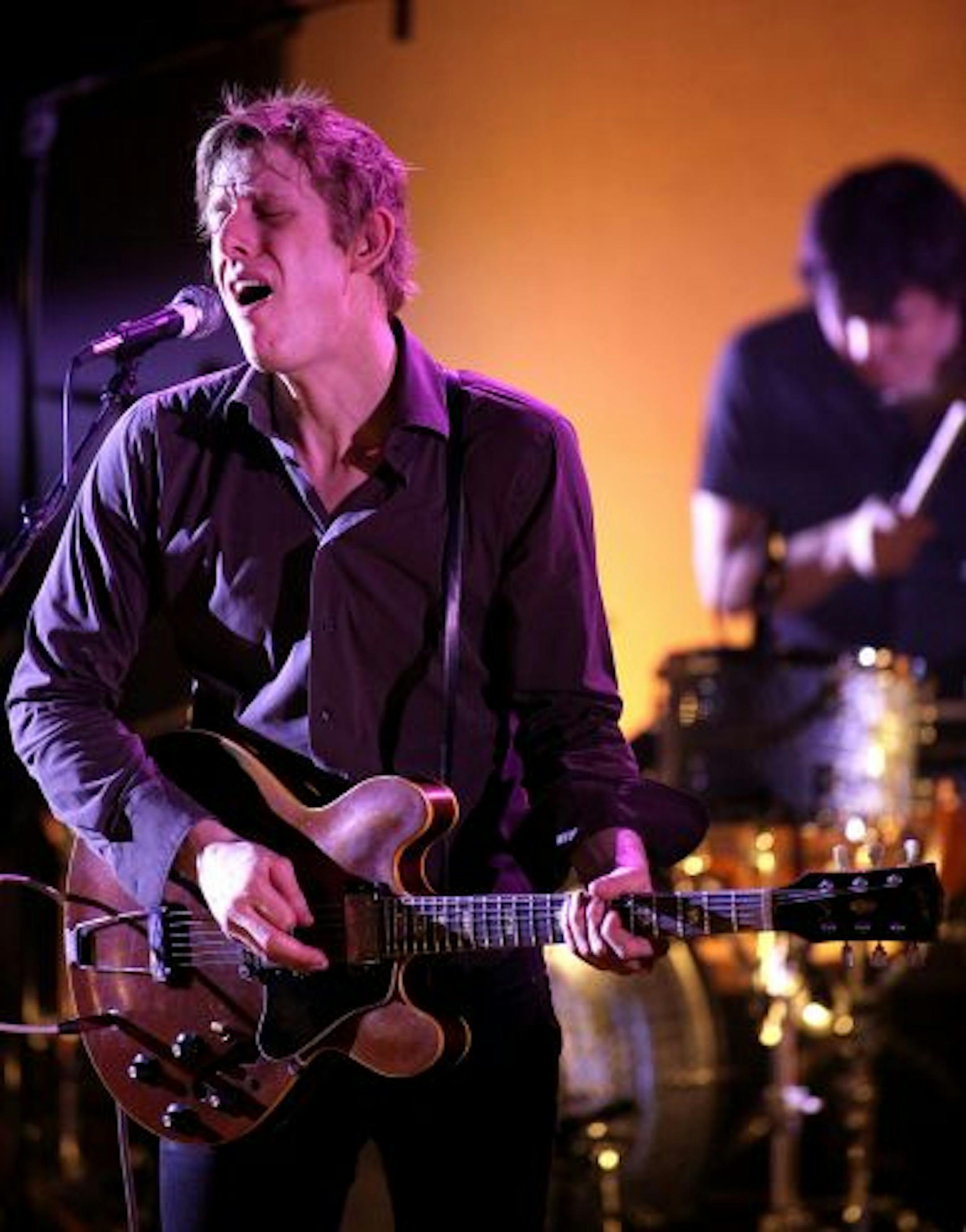 The band Spoon, lead singer/guitarist Britt Daniel, The members of the band include Jim Eno (drums); Rob Pope (bass, backing vocals) and Eric Harvey (keyboard, guitar, percussion, backing vocals).