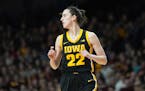 Iowa guard Caitlin Clark (22) stands on the court during the first half of an NCAA college basketball game against Minnesota, Wednesday, Feb. 28, 2024
