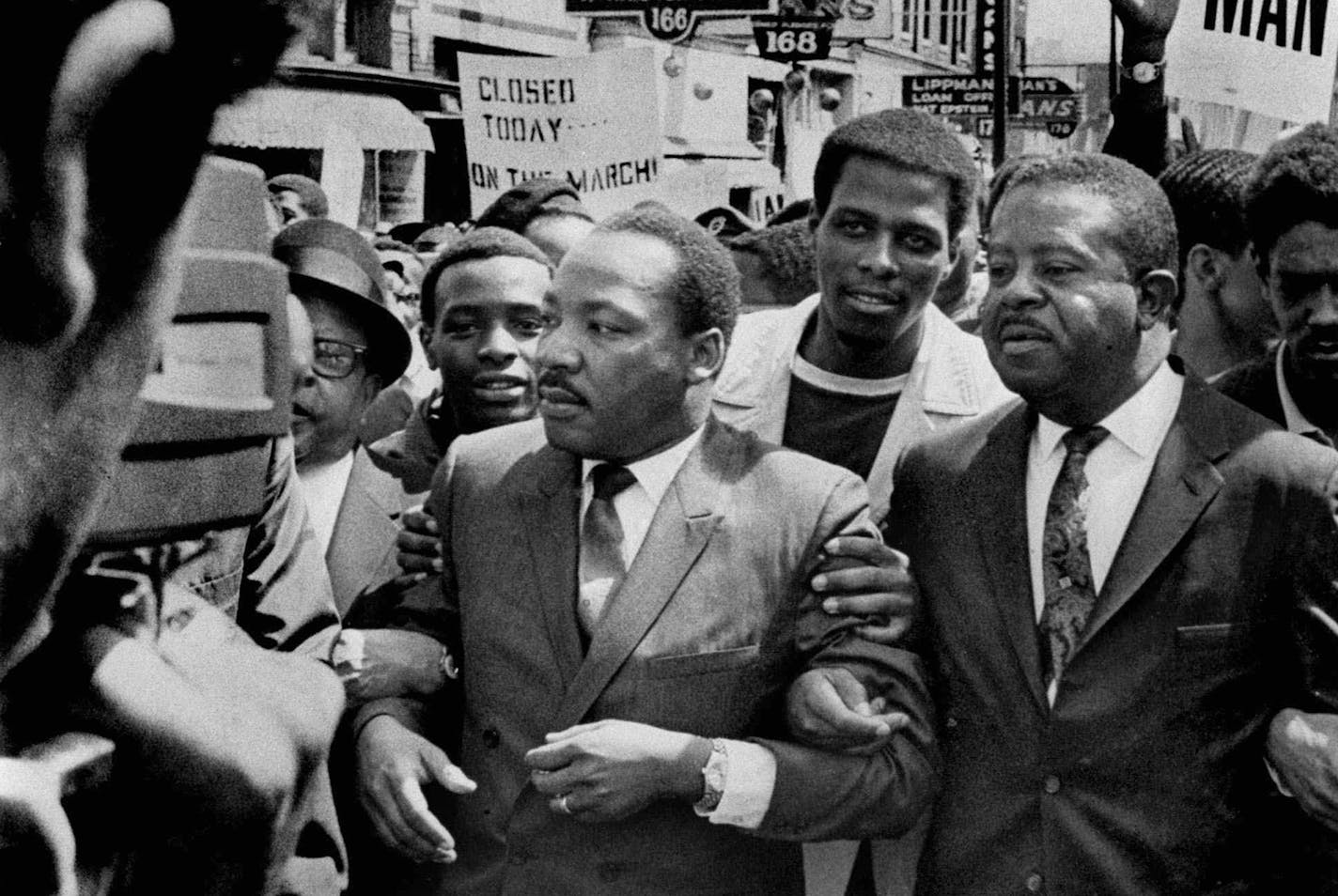 FILE -In this March 28, 1968 file photo, Dr. Martin Luther King Jr. and Rev. Ralph Abernathy, right, lead a march on behalf of striking Memphis, Tenn., sanitation workers. Forty-five years after Martin Luther King Jr. was killed supporting a historic sanitation workers strike in Memphis, the city&#xed;s garbage and trash collectors are fighting to hold on to jobs that some city leaders want to hand over to a private company. (AP Photo/The Commercial Appeal, Sam Melhorn, File)