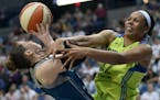 Dallas Wings forward Plenette Pierson (22) fouled Minnesota Lynx guard Lindsay Whalen (13) as she attempted a shot late in the second quarter Saturday