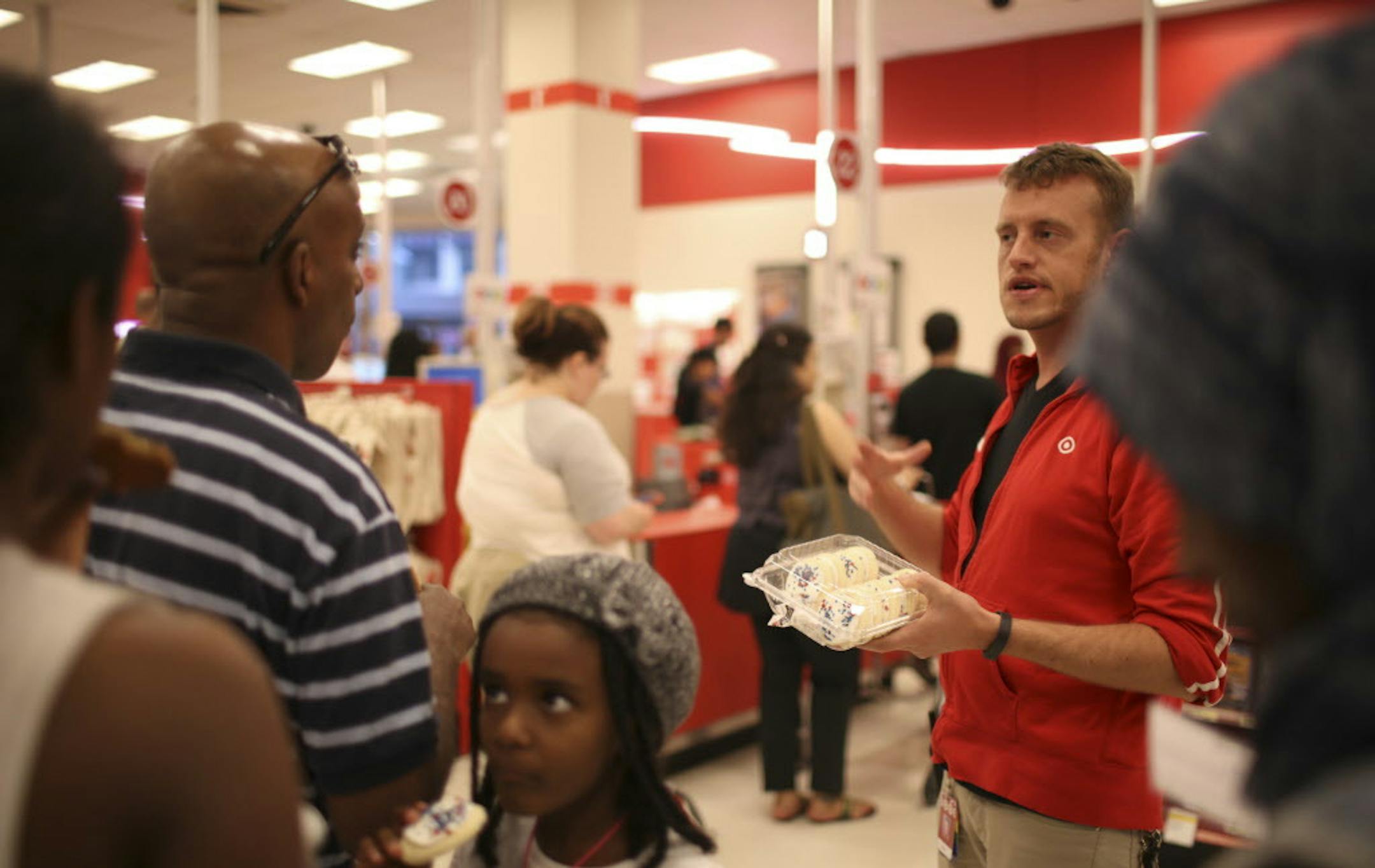 A Target staffer explained the reason for the delays and offered cookies to customers waiting in line to check out at the downtown Minneapolis Target store Sunday night. ] JEFF WHEELER ‚Ä¢ jeff.wheeler@startribune.com A network outage caused checkout delays at Target stores Sunday evening. Managers were handing out $3 coupons and offering cookies to customers as they waited in line to check out. ORG XMIT: MIN1406152046370991