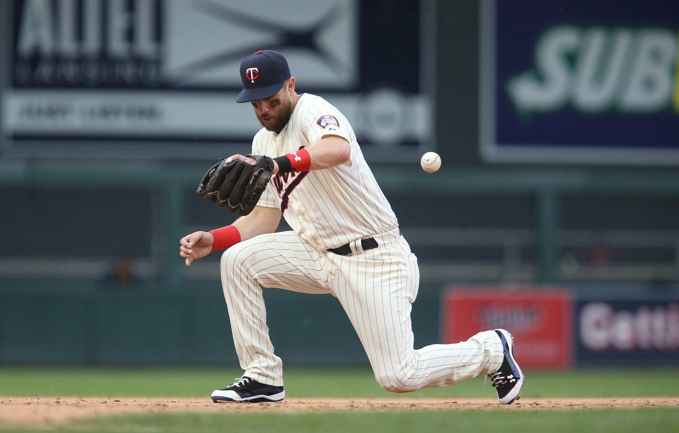Trevor Plouffe #24 of the Minnesota Twins misjudged the hop on the all allowing Luis Sardinas #10 of the Milwaukee Brewers to reach first base in the ninth inning. ] (KYNDELL HARKNESS/STAR TRIBUNE) kyndell.harkness@startribune.com Twins: vs. Milwaukee at Target Field in Minneapolis, Min., Saturday, June 6, 2015. Brewers won 4-2.