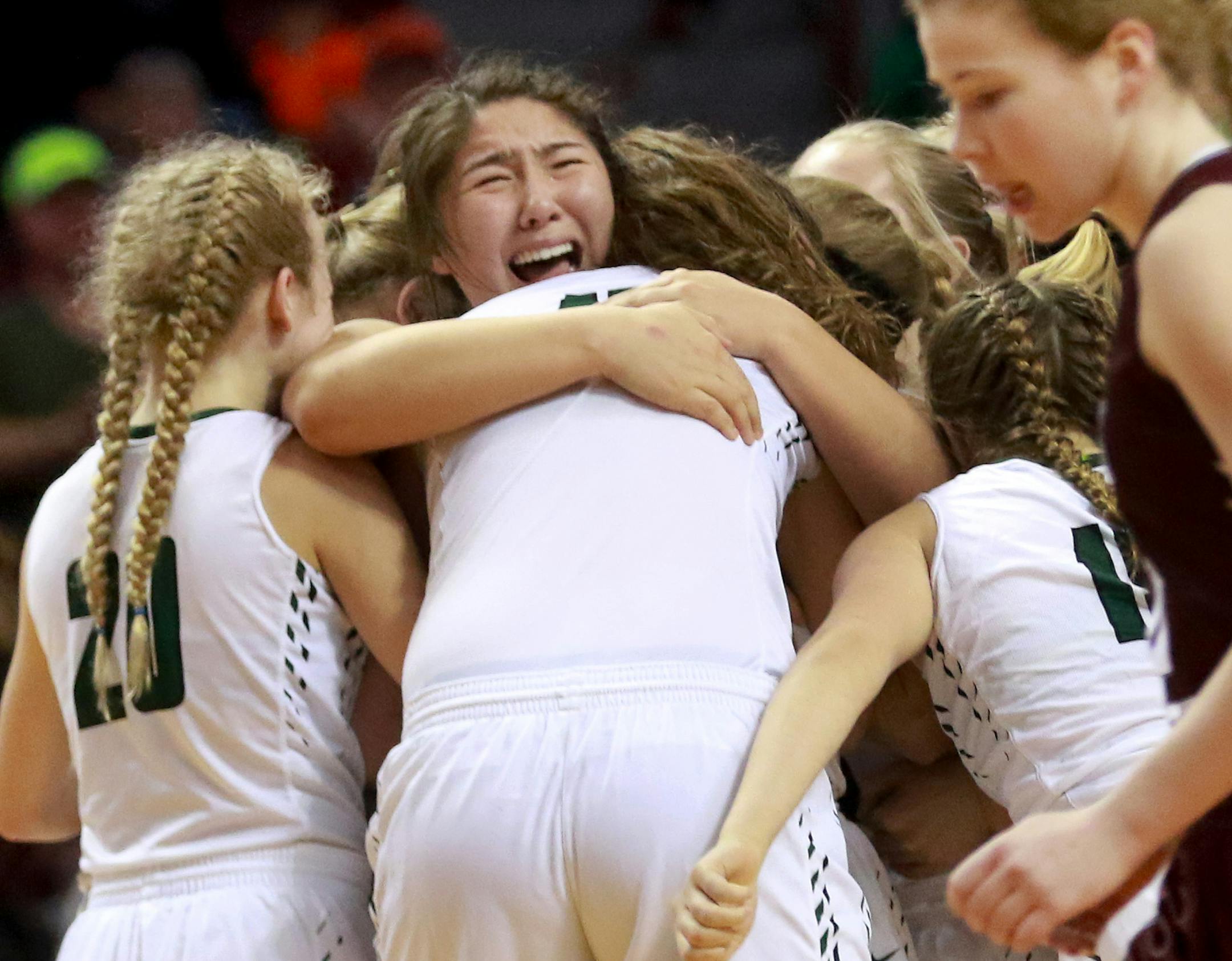 Roseau players celebrate at the end of their 75-64 victory over Sauk Centre during the girls' basketball state tournament, Class 2A championship Saturday, March 18, 2017, at Williams Arena on the University of Minnesota campus in Minneapolis, MN.] DAVID JOLES ï david.joles@startribune.com girls' basketball state tournament