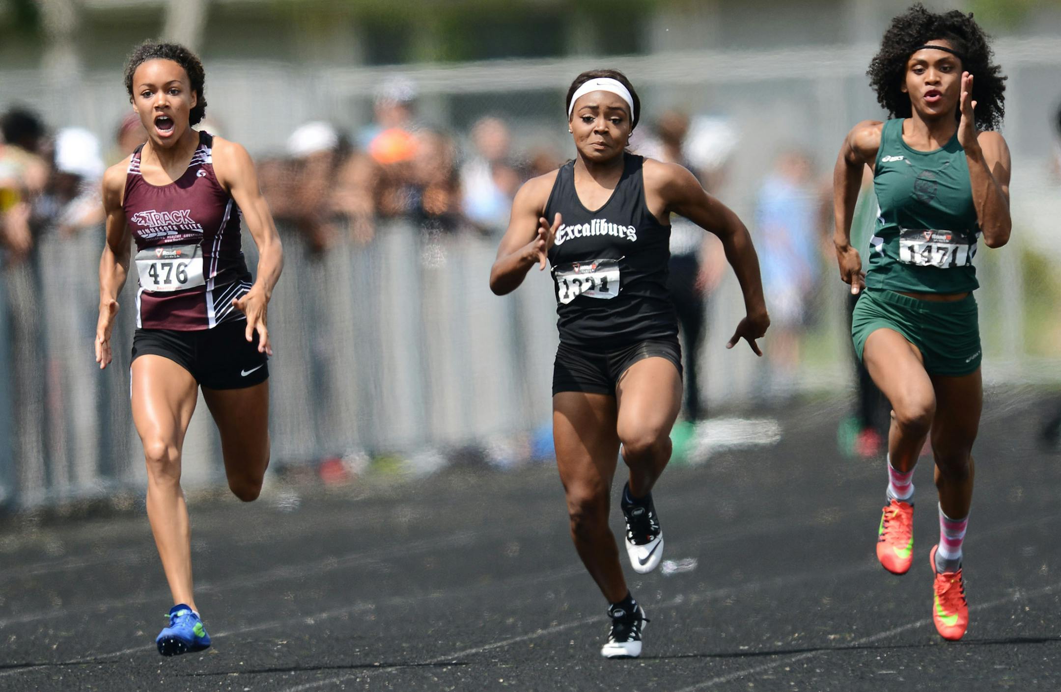From left, Jedah Caldwell, Briyana Carter and Brieasha Hunter ran during the 100 meter final at the AAU Regional Track & Field Championship in Brooklyn Park, Minn., on Sunday June 28, 2015. ] RACHEL WOOLF ∑ rachel.woolf@startribune.com